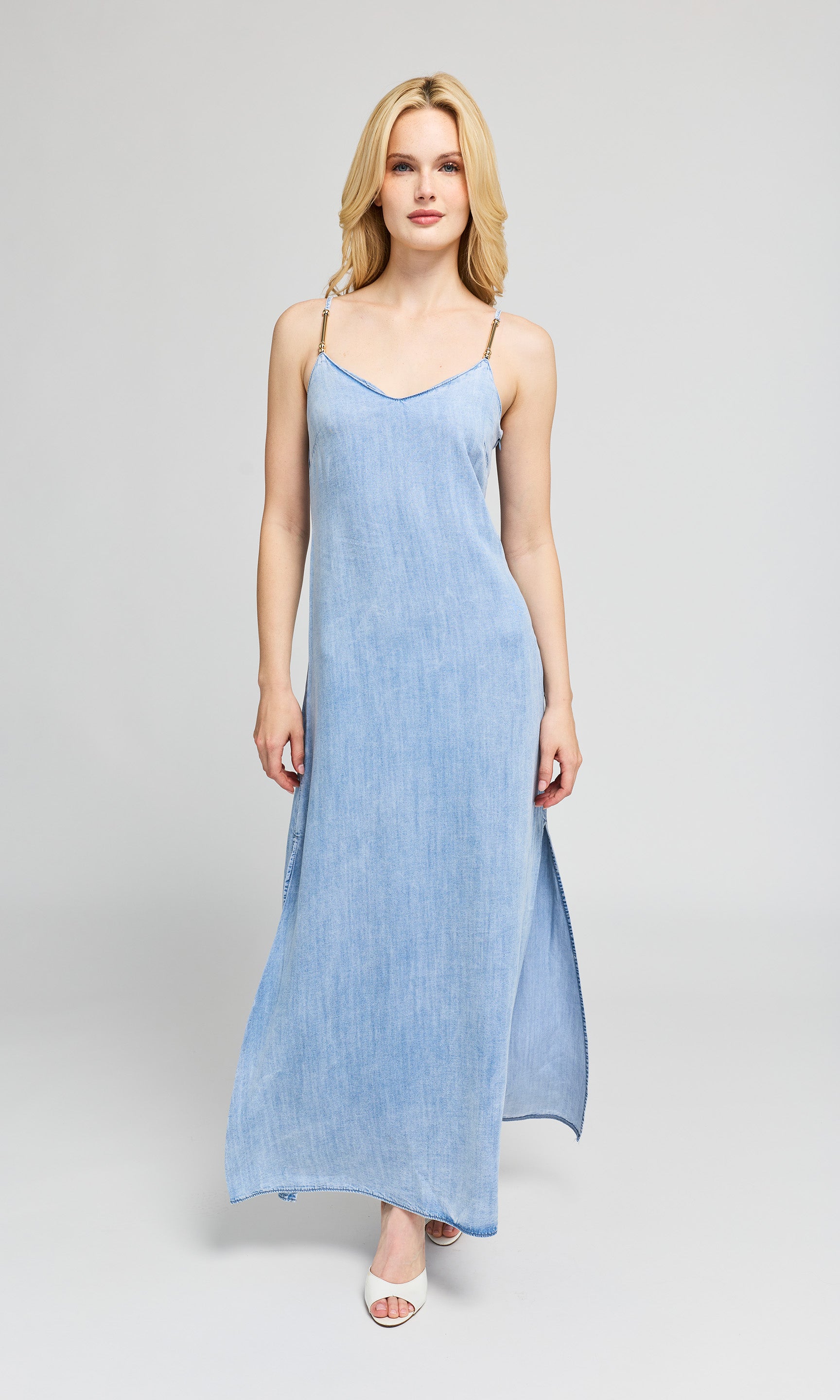 Woman wearing a light blue dress on a white background