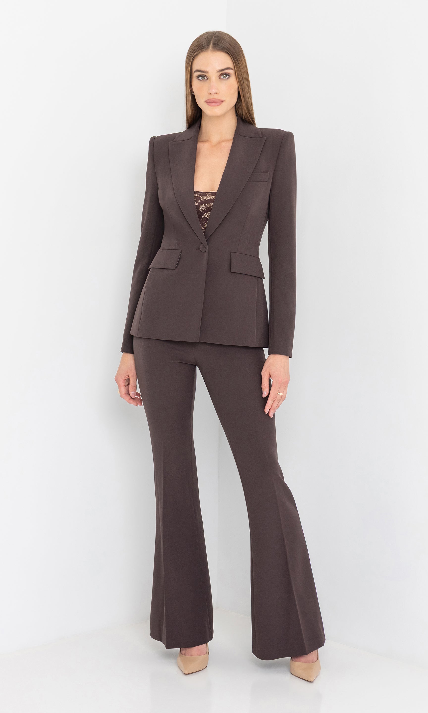 Full body front view of the model in the aimee crepe blazer styled with trousers.