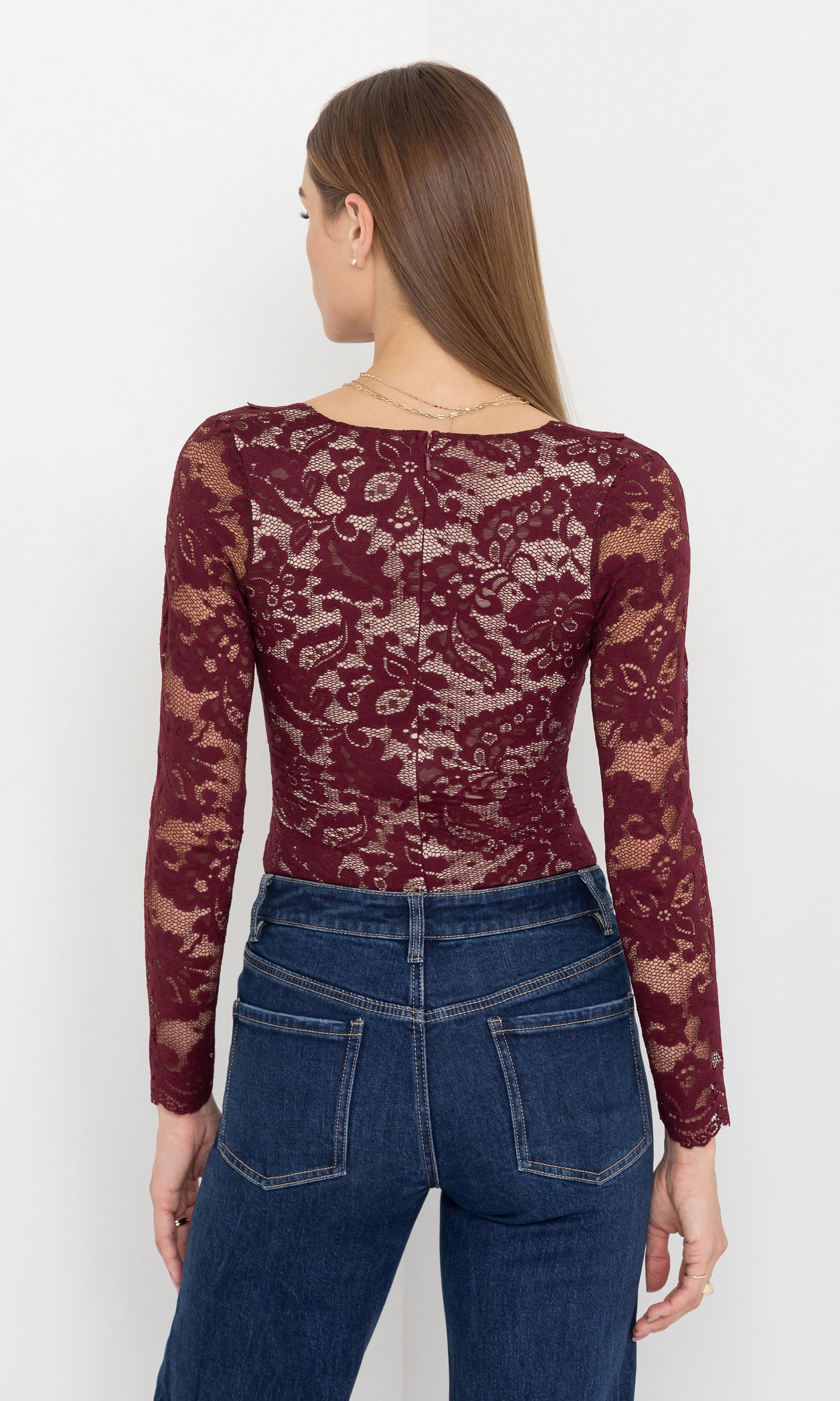 Back view of the alessia lace bodysuit showing the fitted silhouette.