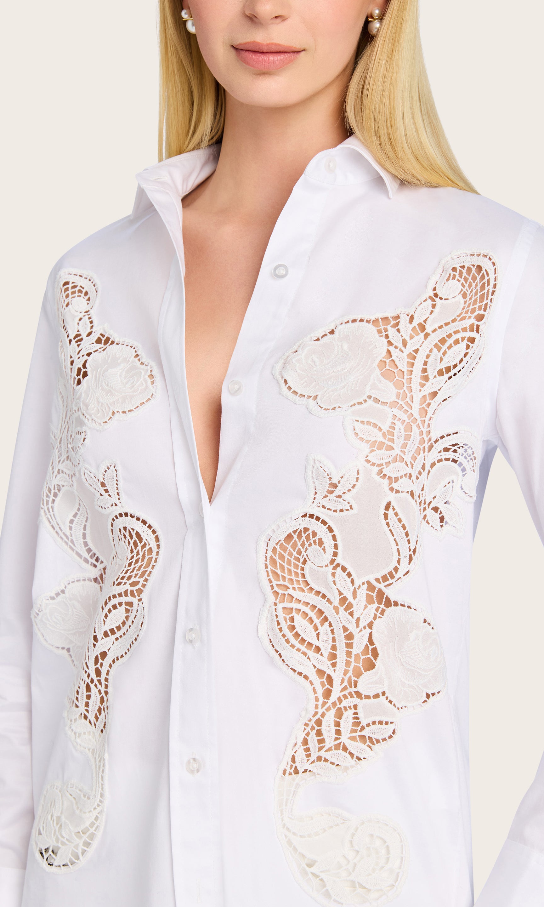 A close-up of the model wearing the Bruno Emb Poplin Shirt reveals the intricate floral embroidery and pearl button detail along the placket