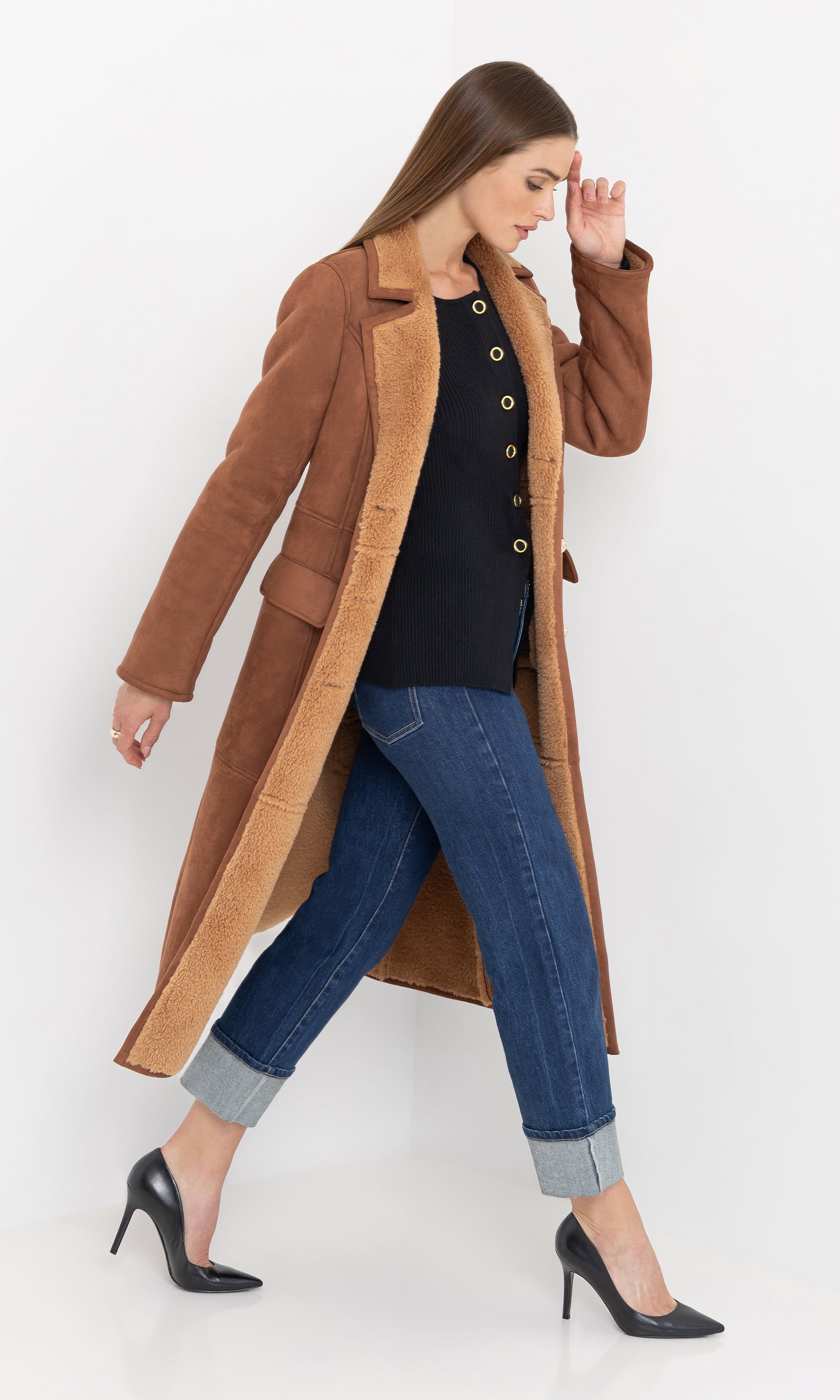 Side view of the benton faux shearling coat showing the long length.