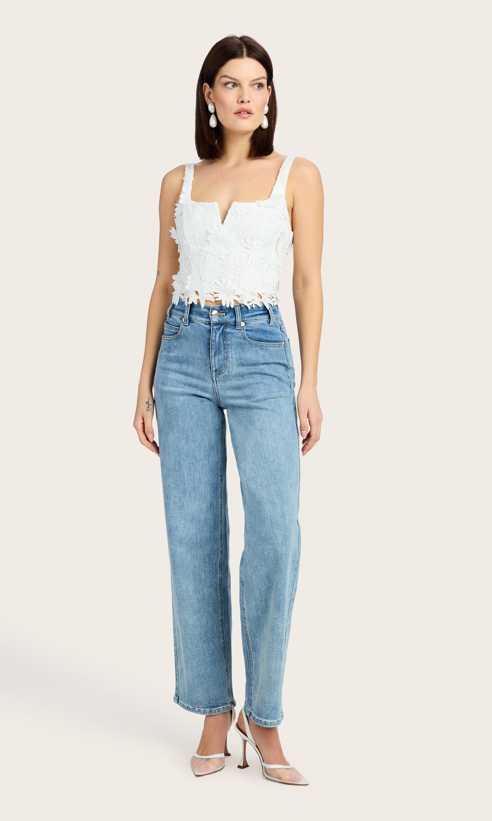 Full body view of the Cassidy 3D Lace Bustier Tank styled with high-waisted jeans