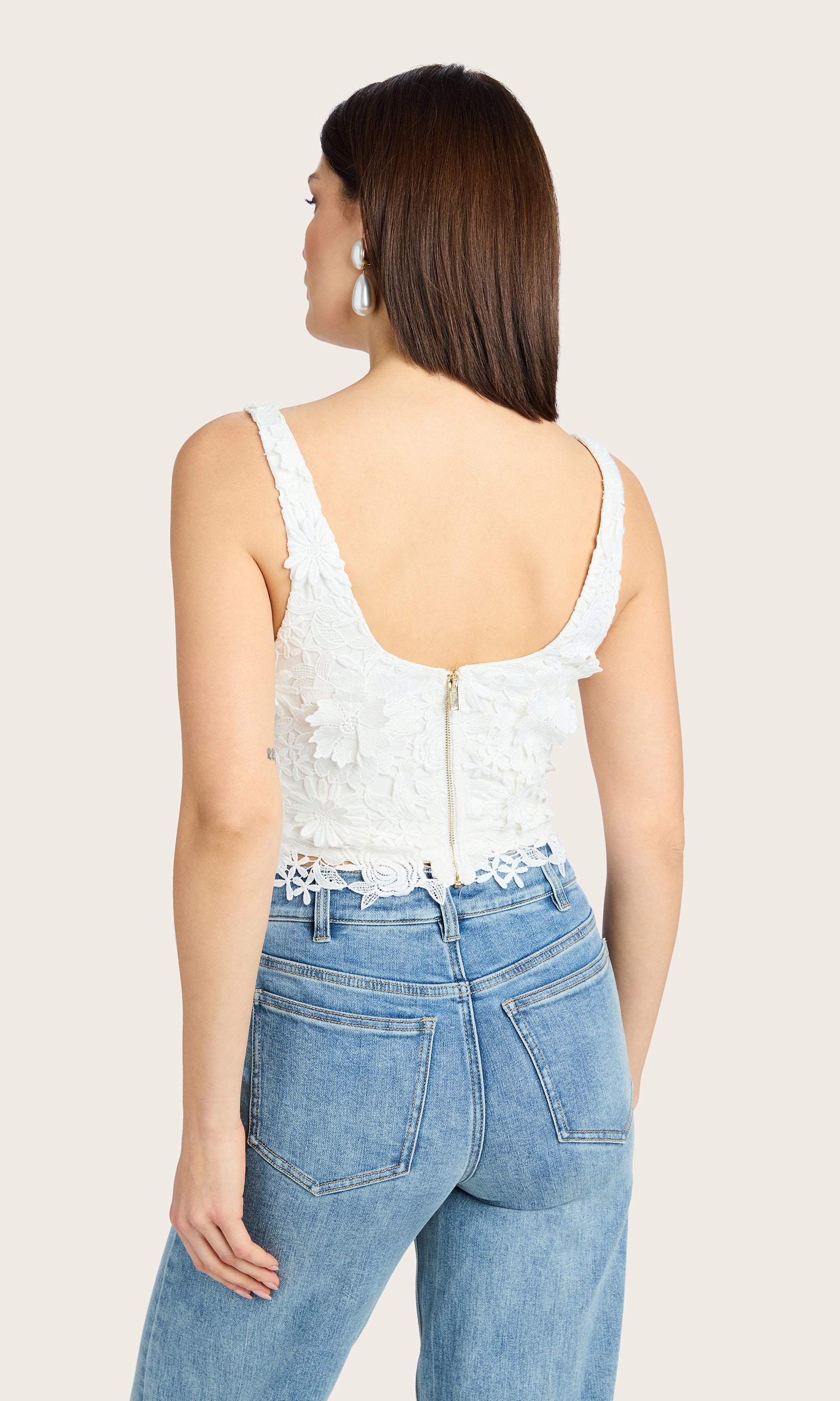 Rear view of the Cassidy 3D Lace Bustier Tank highlighting the fit and cropped hem