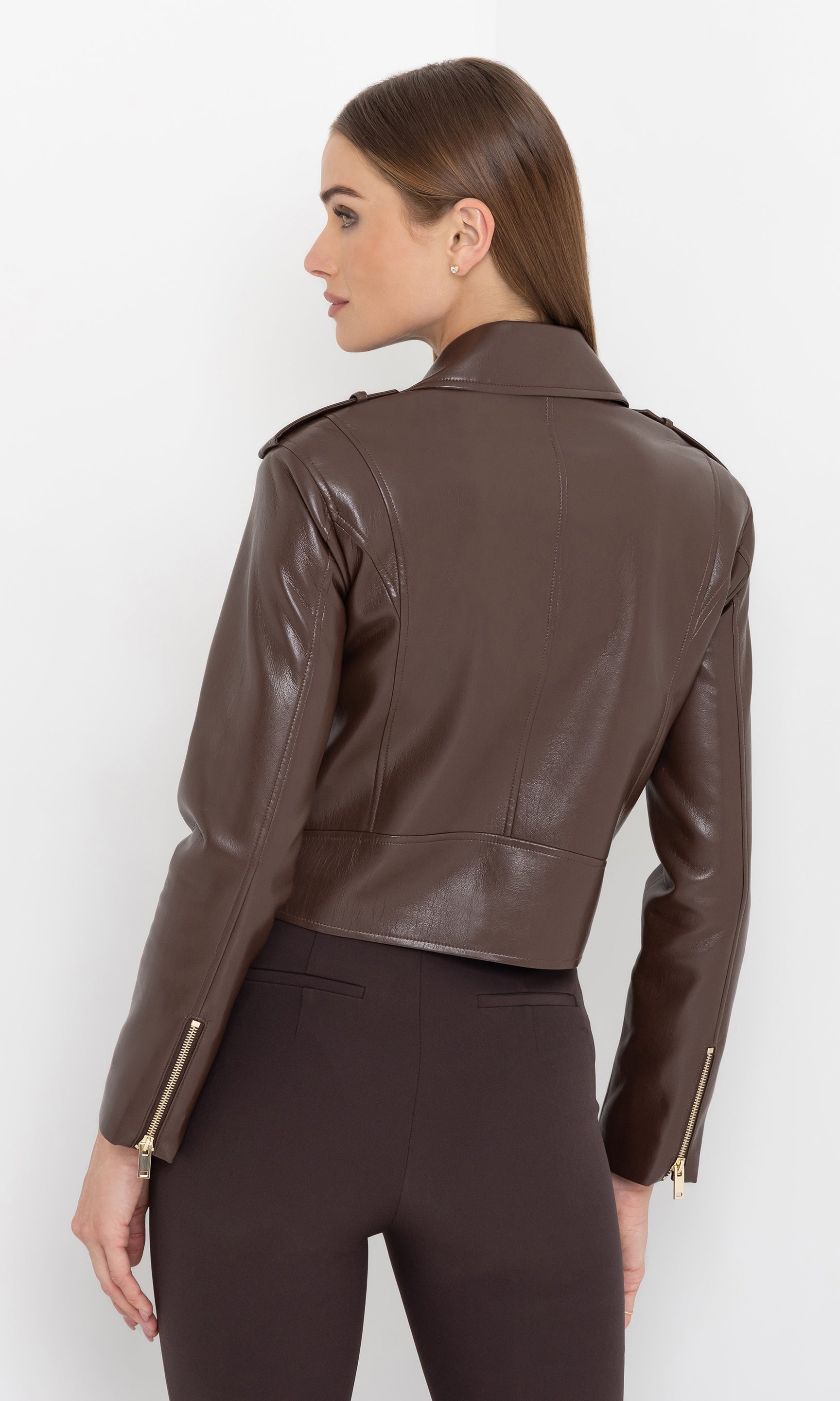 Rear view of the cosita vegan leather jacket showing cropped fit.