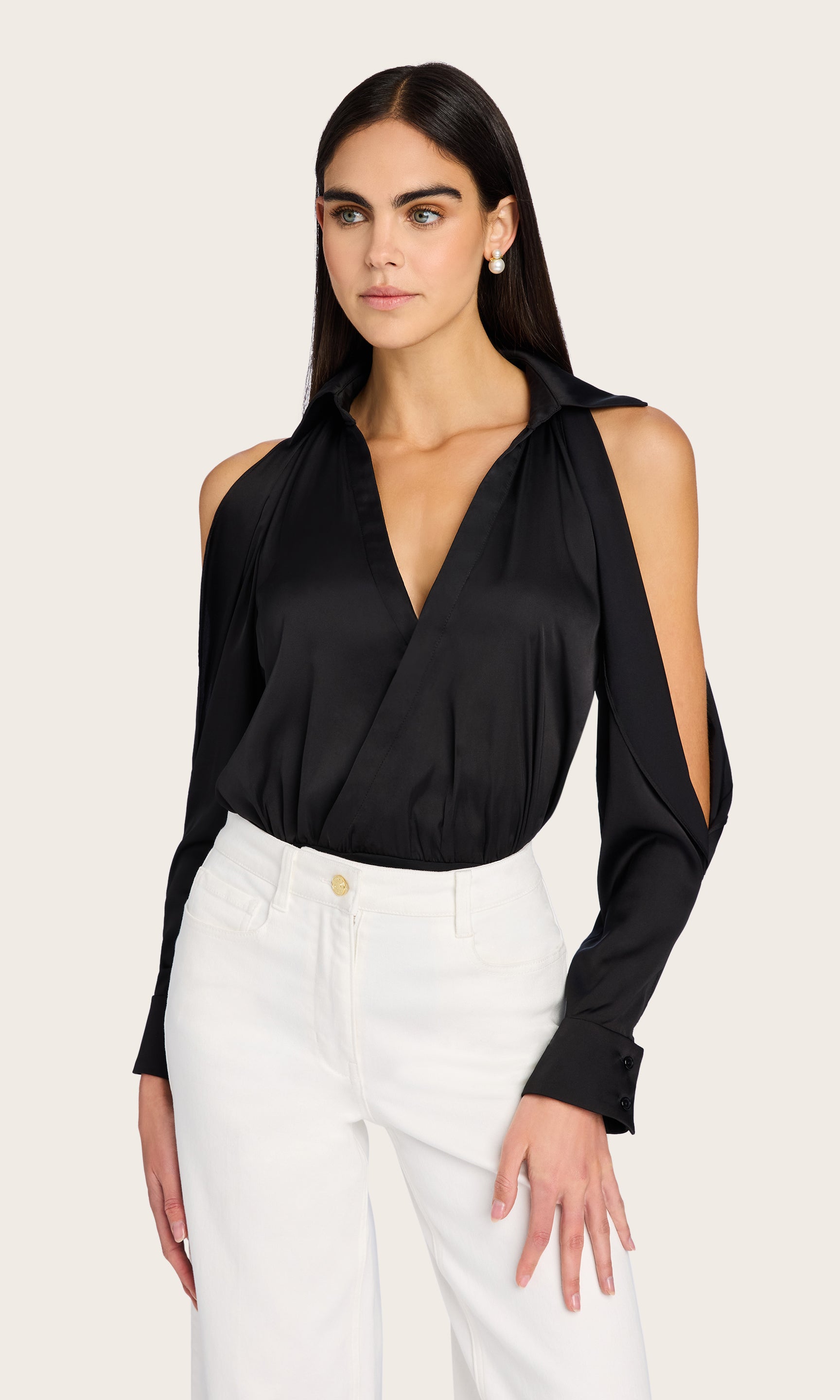Front view featuring the Dee Bodysuit with wide-leg white trousers and gold accessories for an elegant outfit