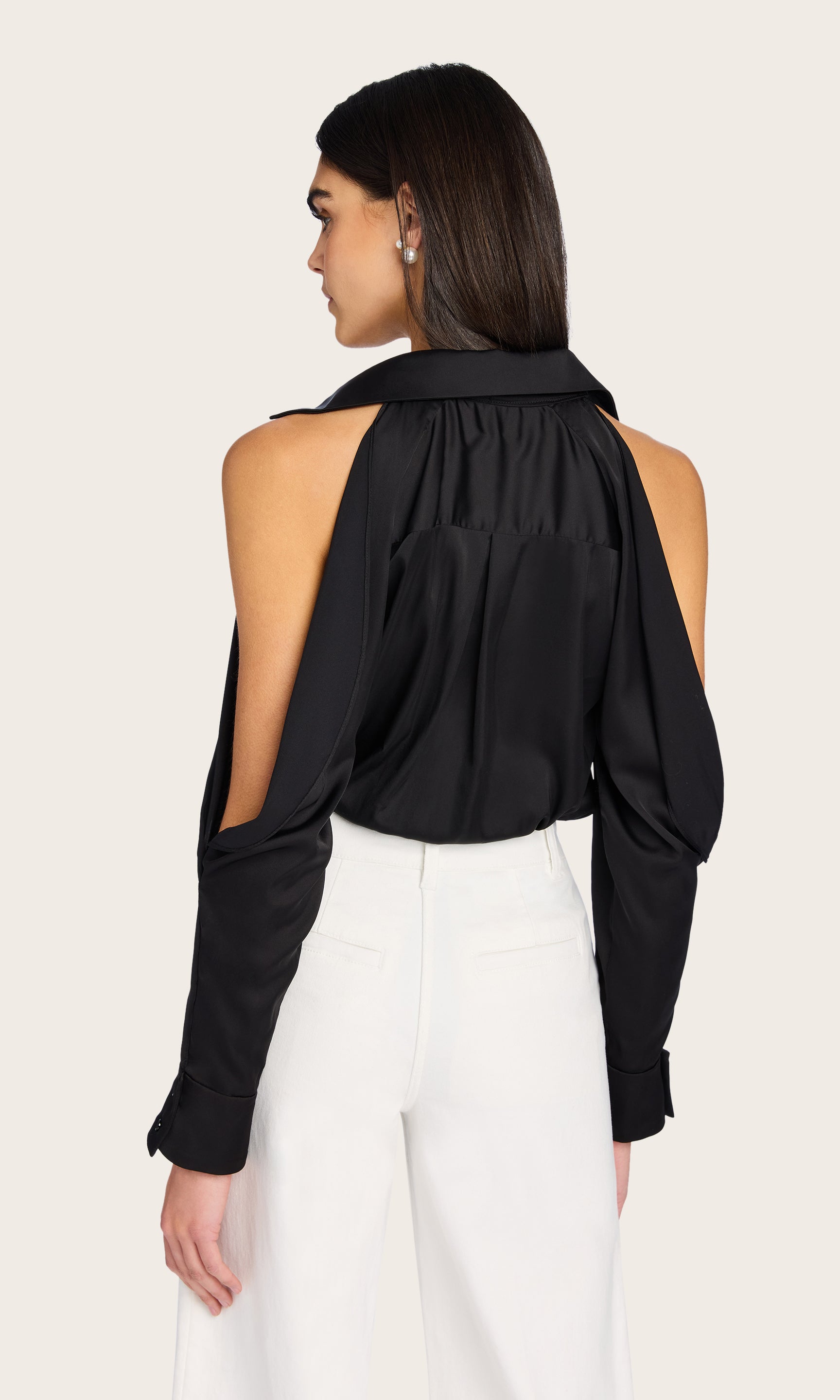Rear view of the Dee Bodysuit highlighting the open shoulder design and sleek back silhouette
