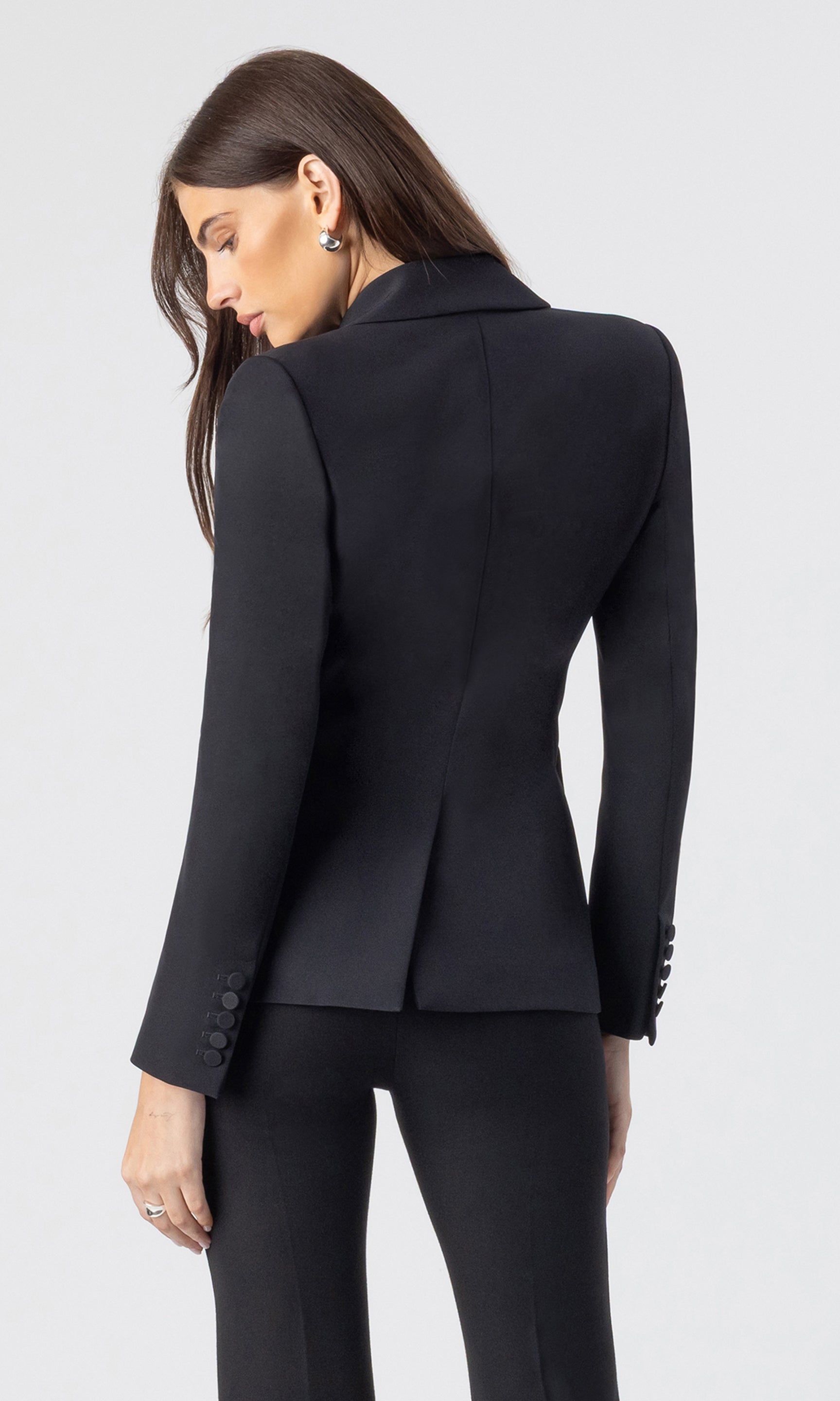 back view image of model wearing the Aimee crepe blazer in black with matching black trousers