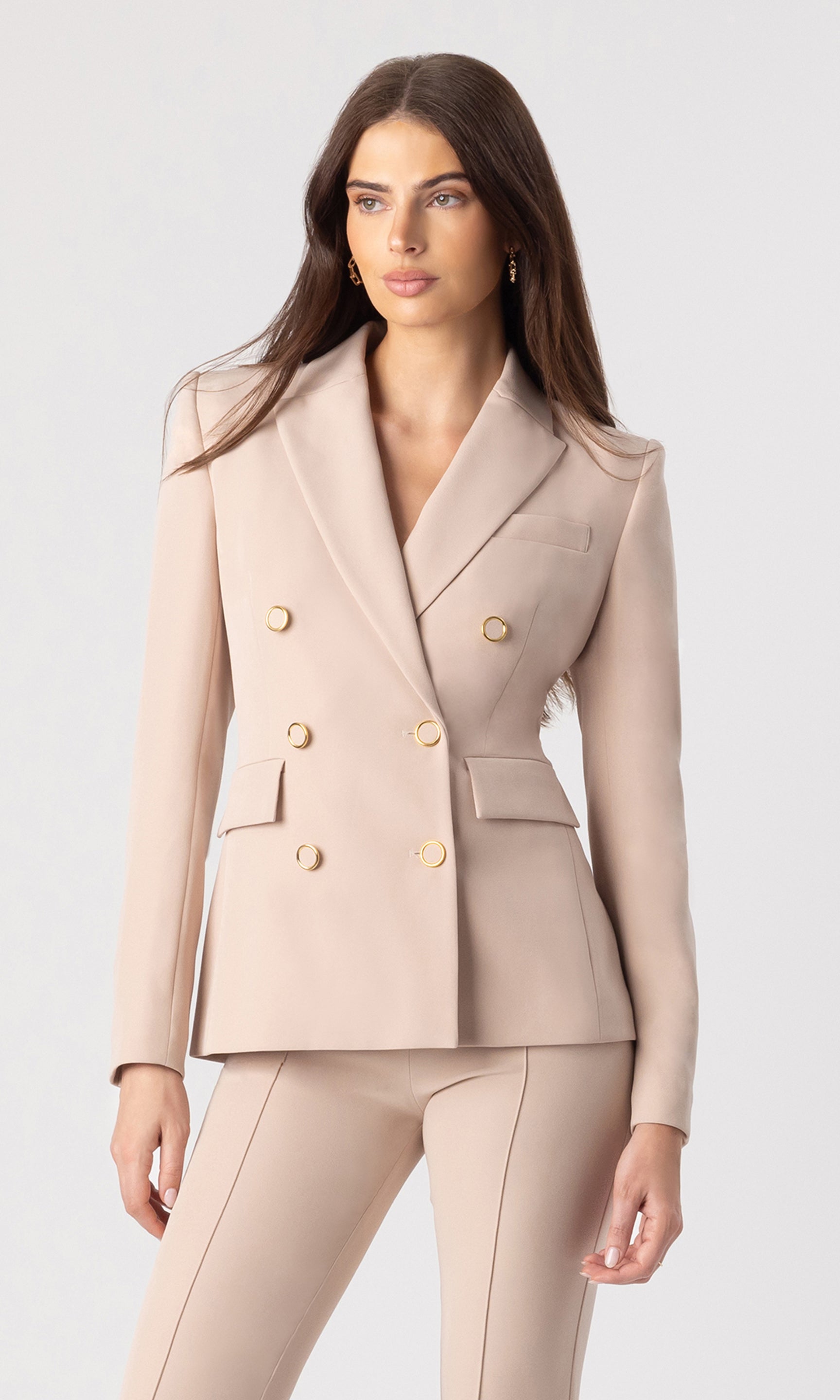3/4 view image of model wearing the Arielle crepe blazer in latte with matching latte trousers