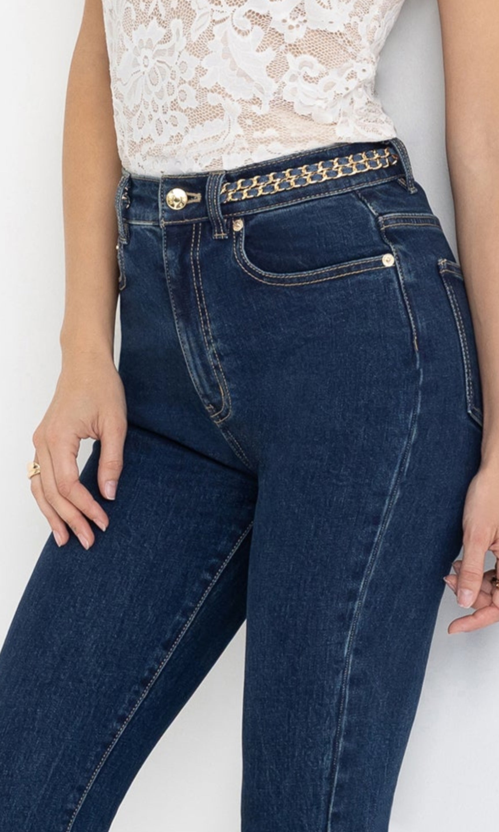 Close-up front view of the Darren Denim Pants, focusing on the high-waist design and button-fly detail.