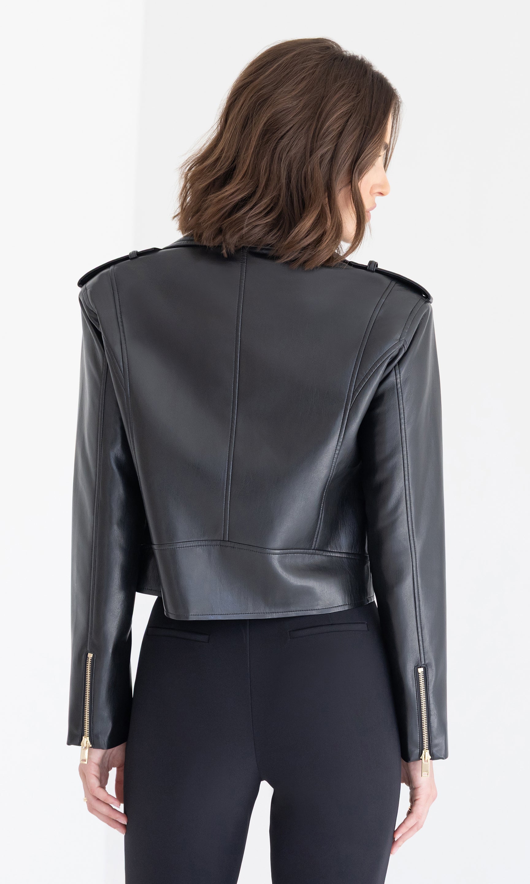Rear view of the Cosita Vegan Leather Jacket in black, showing its smooth finish and fitted cut.