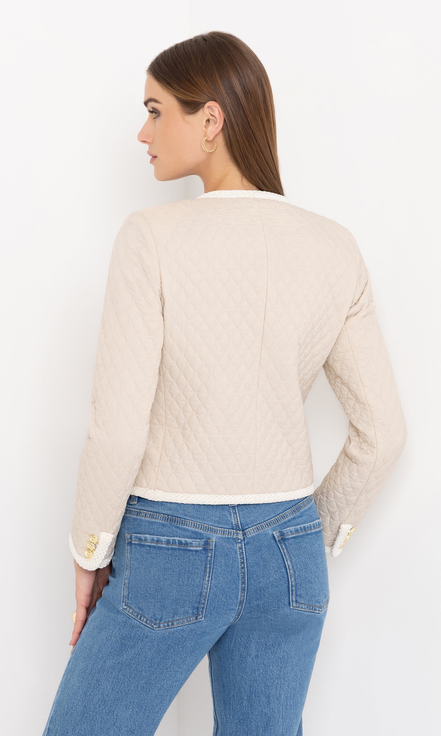 Rear view showing the back panel design and straight fit of the cream Everie Quilted Jacket.