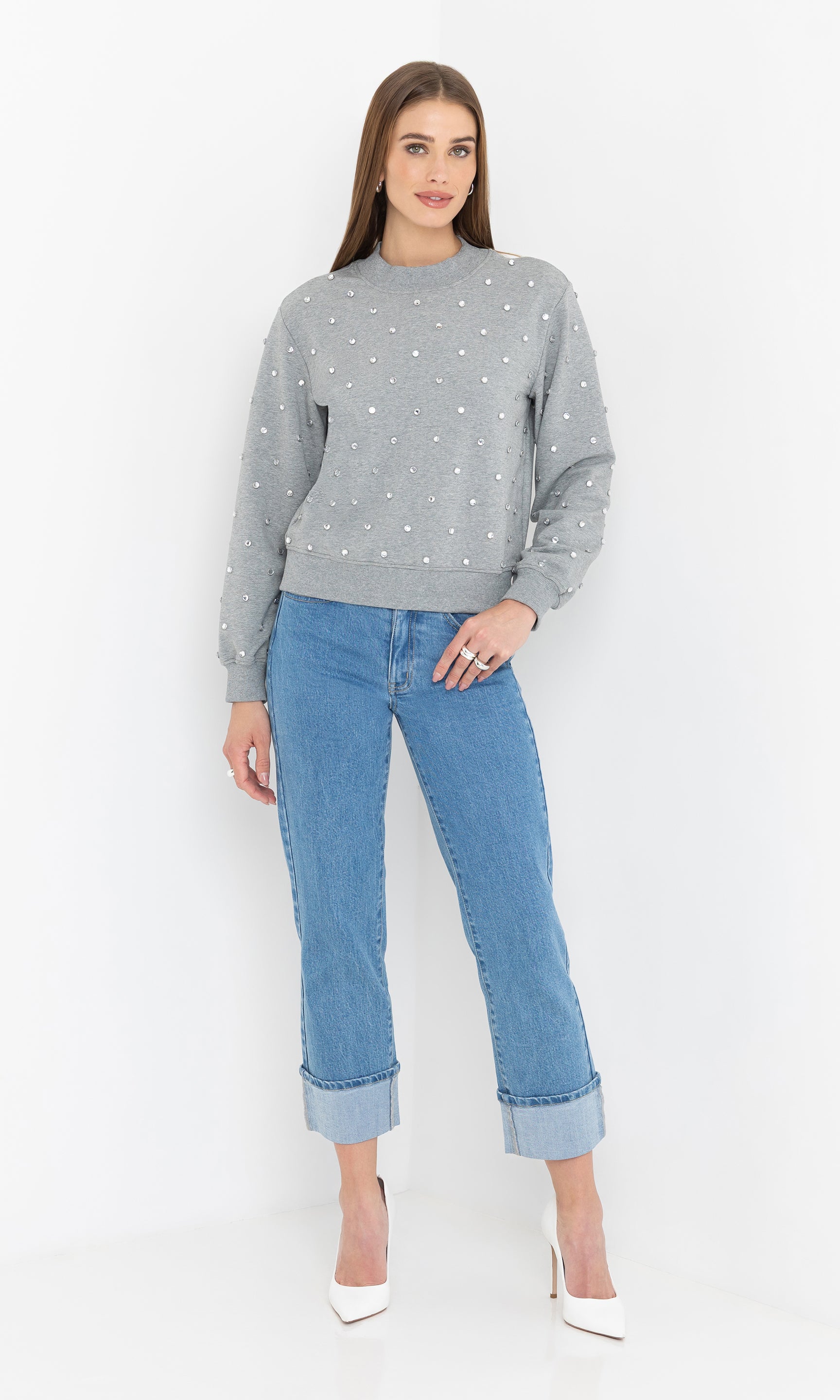Full body front view of the Julie Crystal Stud Sweatshirt styled casually with light blue jeans.