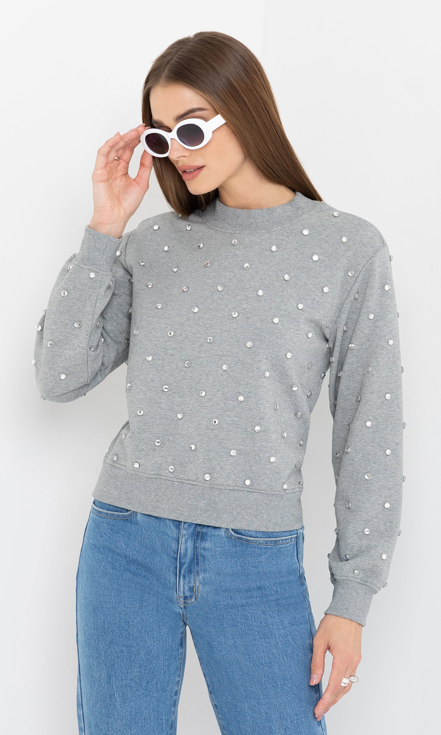 Side view of the Julie Crystal Stud Sweatshirt, displaying the relaxed silhouette and drop-shoulder design.