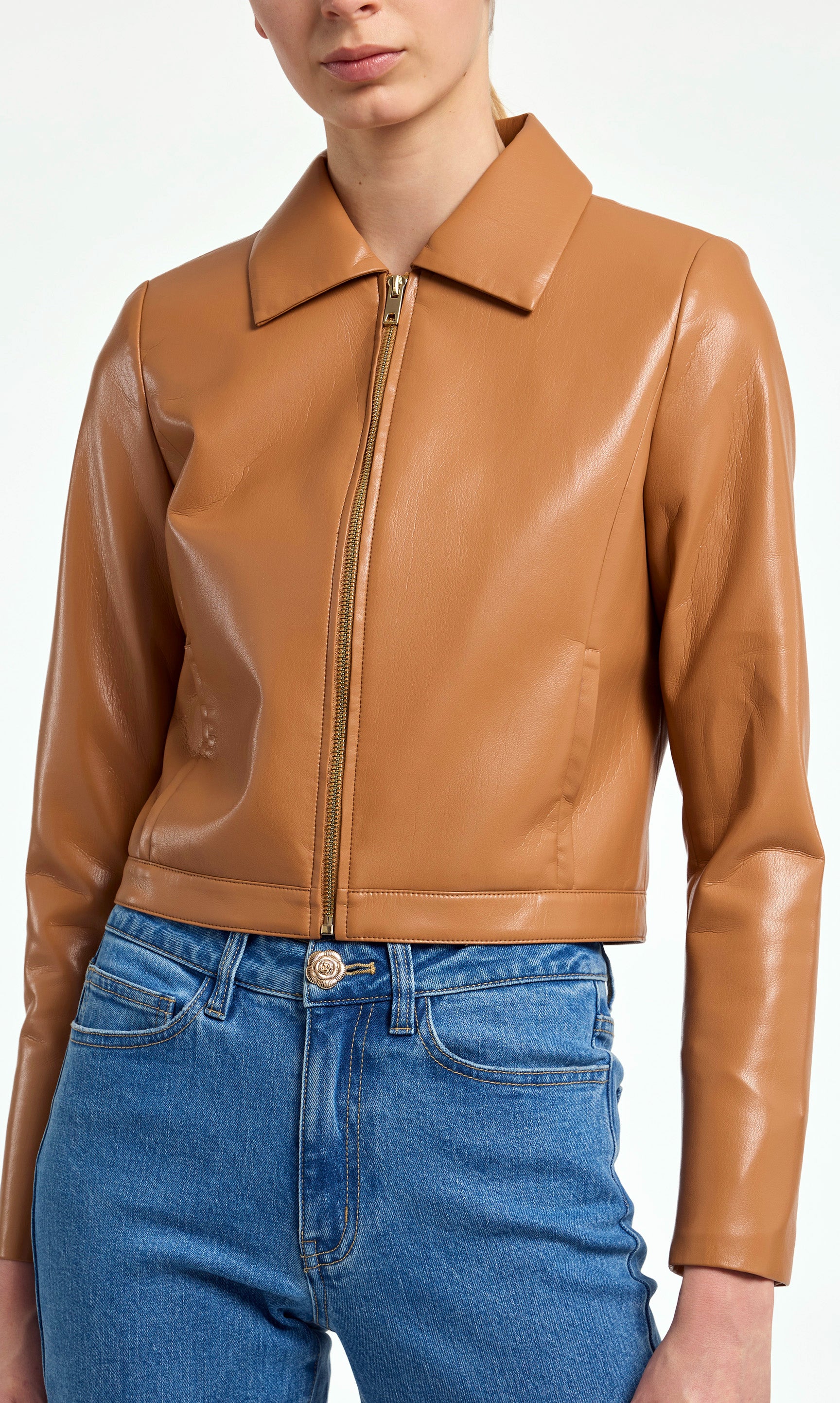 Brown leather jacket worn by a person on a white background