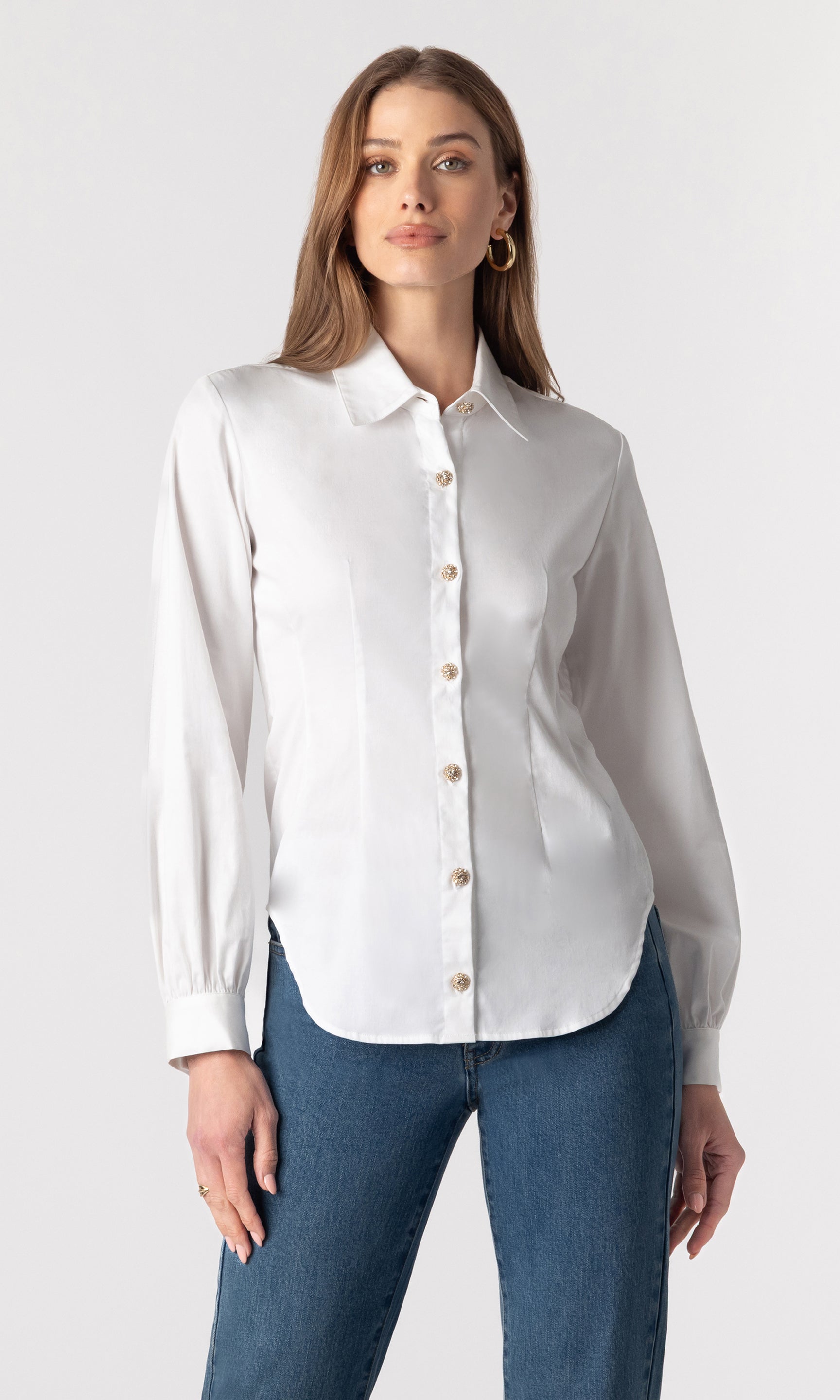 image of model wearing the Lonny button-down blouse paired with dark blue jeans