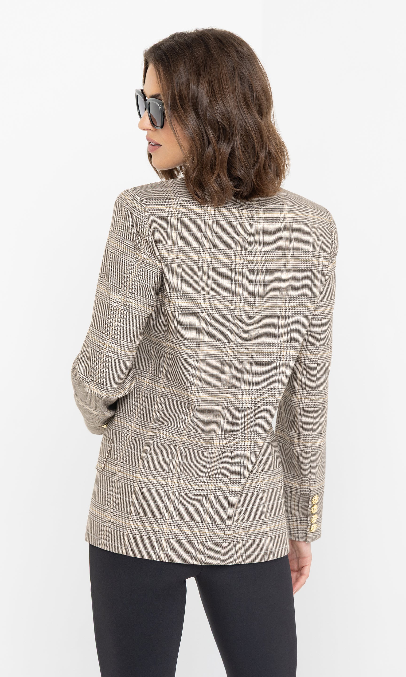 Rear angle view showcasing the structured shoulders and tailored fit of the blazer.