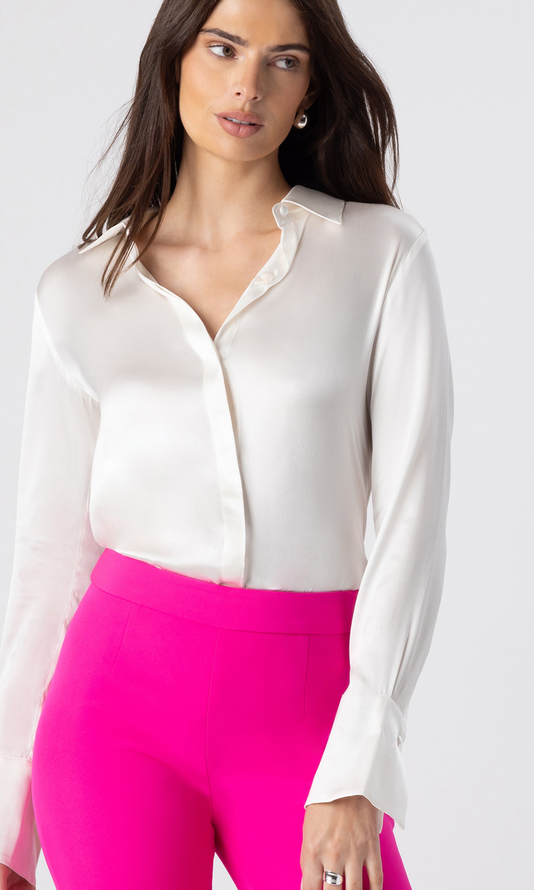 zoomed in image of model wearing the Maxwell blouse in white paired with hot pink crepe pants
