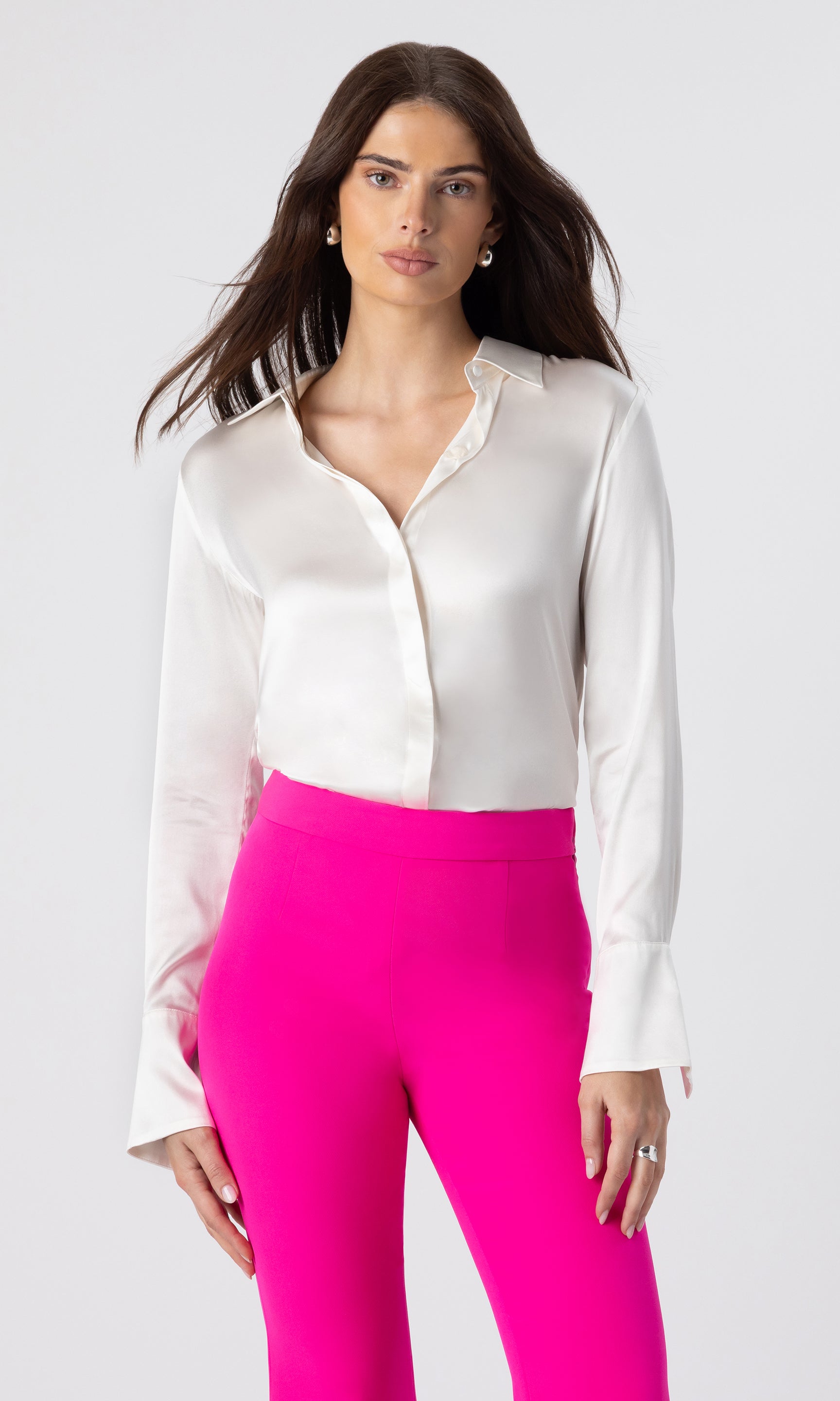 image of model wearing the Maxwell blouse in white paired with hot pink crepe pants