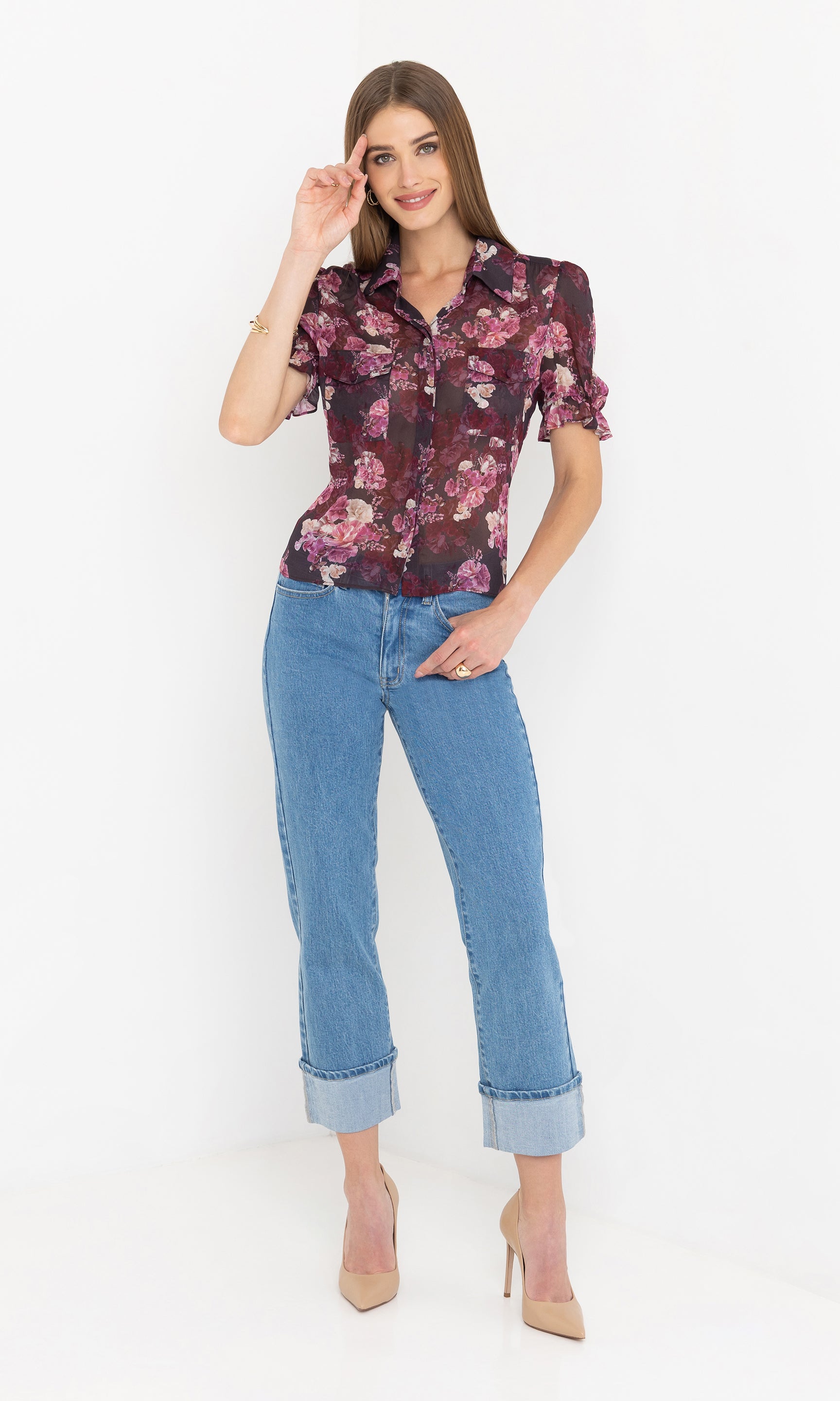 Front view of the Mina Floral Georgette Shirt with jeans, the model smiling with a relaxed pose.