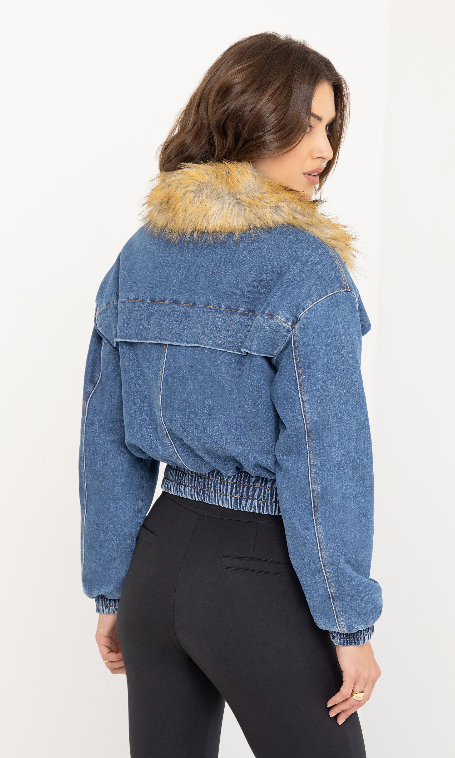 Side view of the Paco Denim Bomber showing the cropped fit and faux fur collar detail.