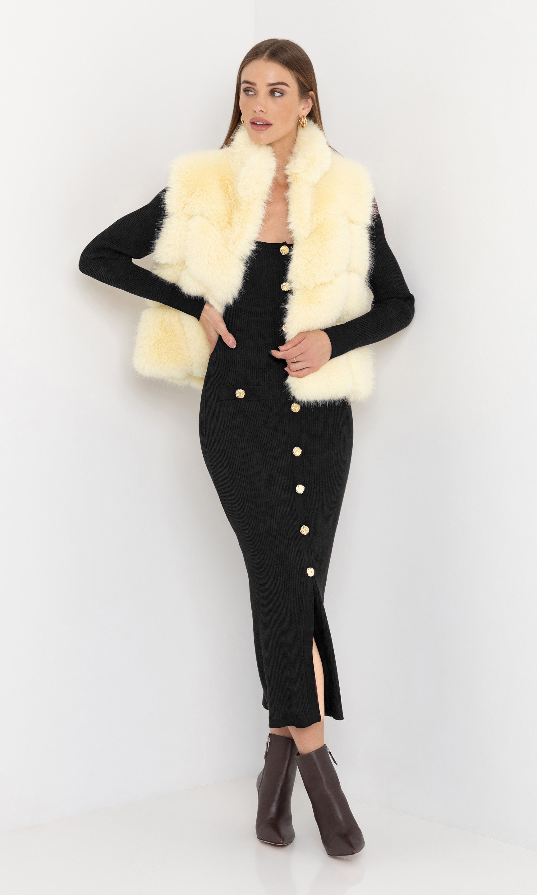 Full body front view of Rosario Faux Fur Vest in cream, paired with a fitted burgundy dress and heels.