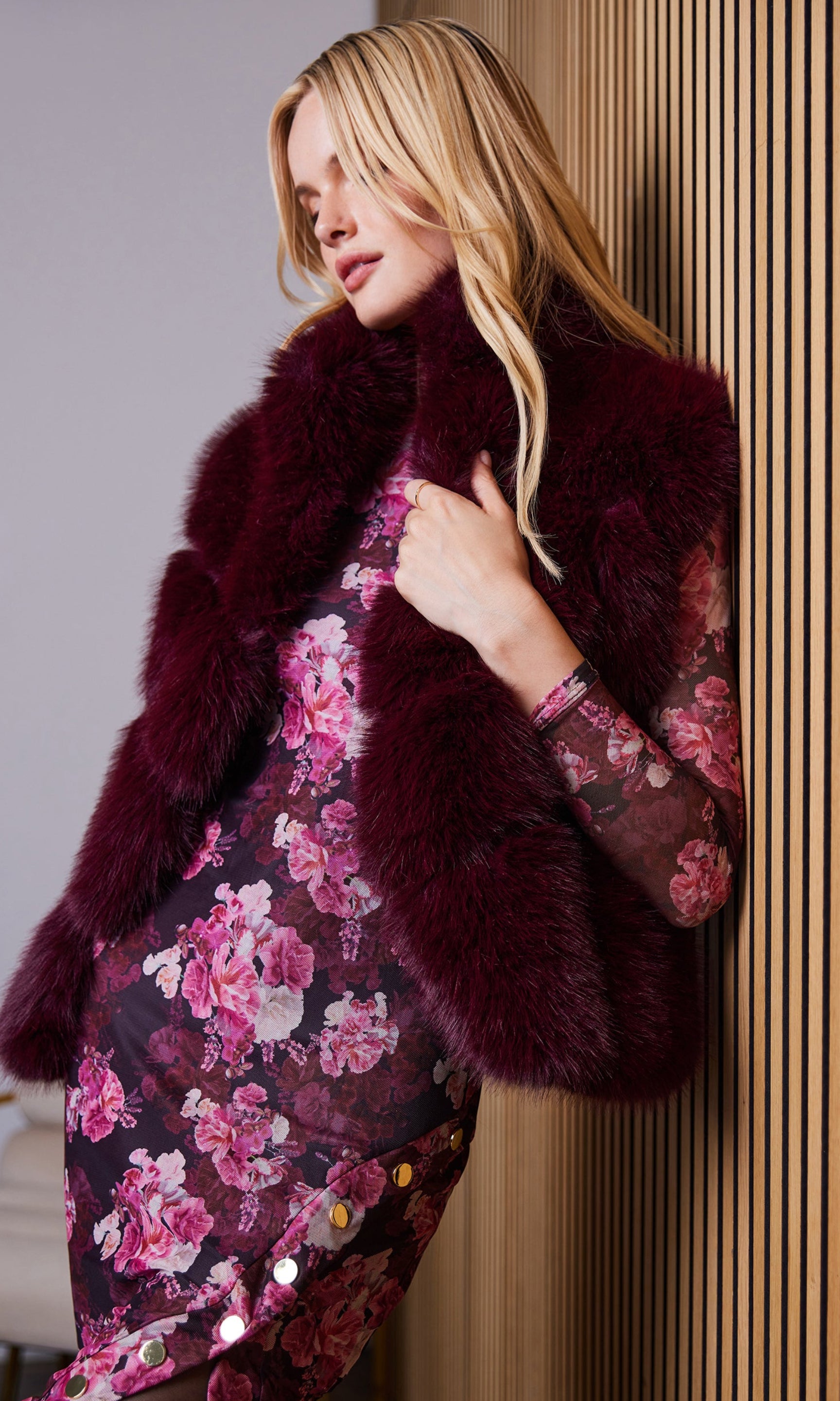 Side view of the rosario faux fur vest highlighting the faux fur texture.