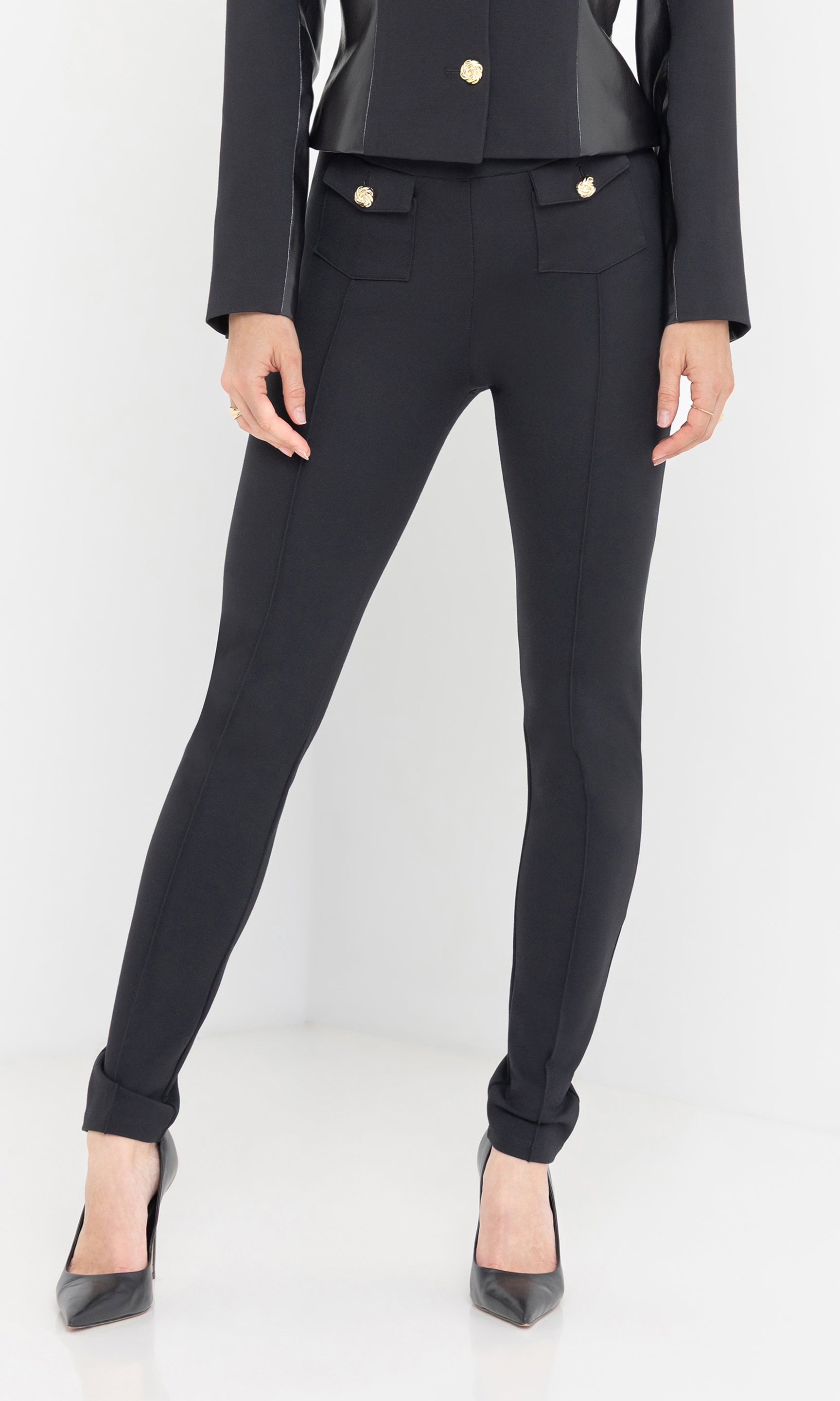 Standing pose in Roy Ponte Leggings, front view highlighting the flattering high-rise fit and tailored finish.