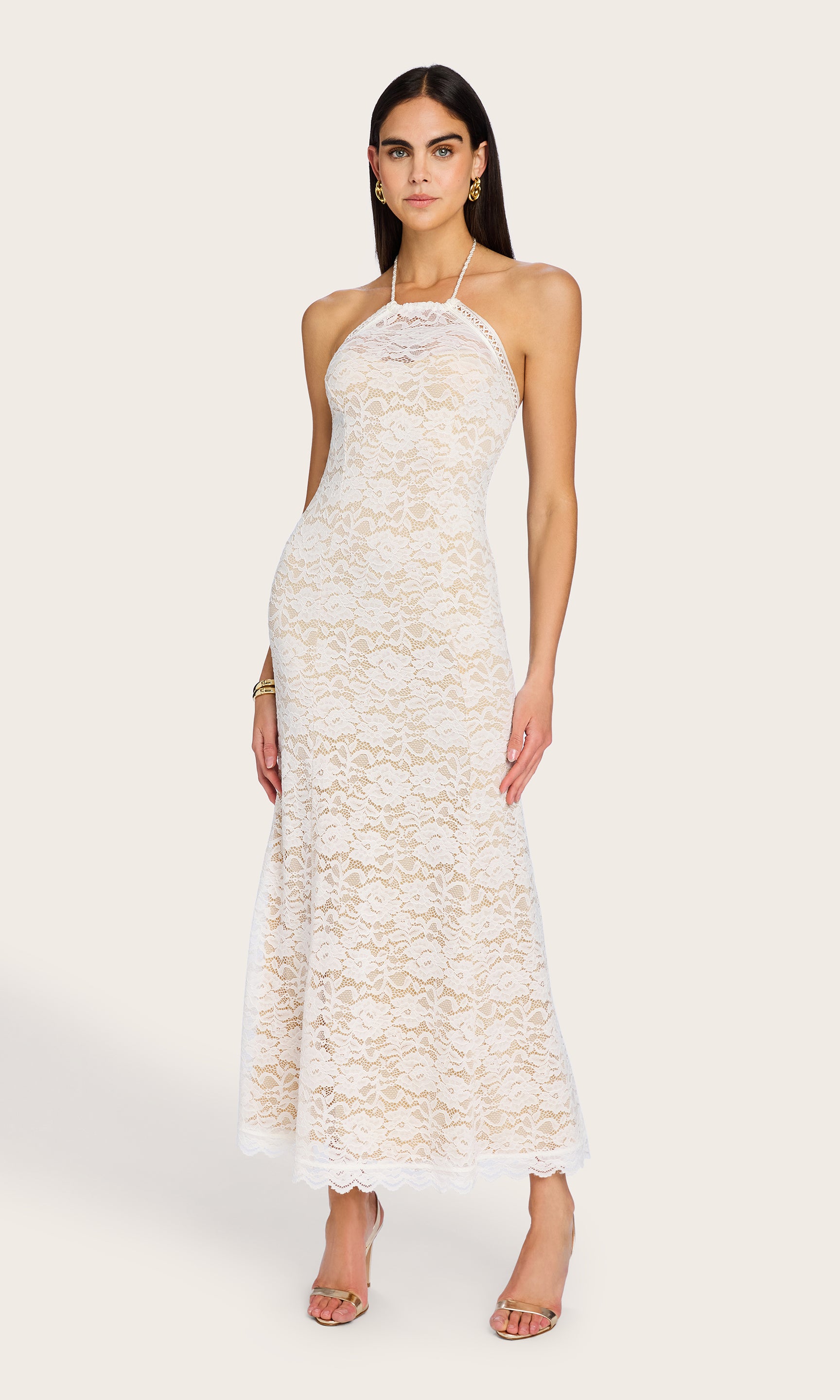 3/4 full-body front view of the model in the Garcia Lace Dress, styled with heels for an elegant warm-weather look.