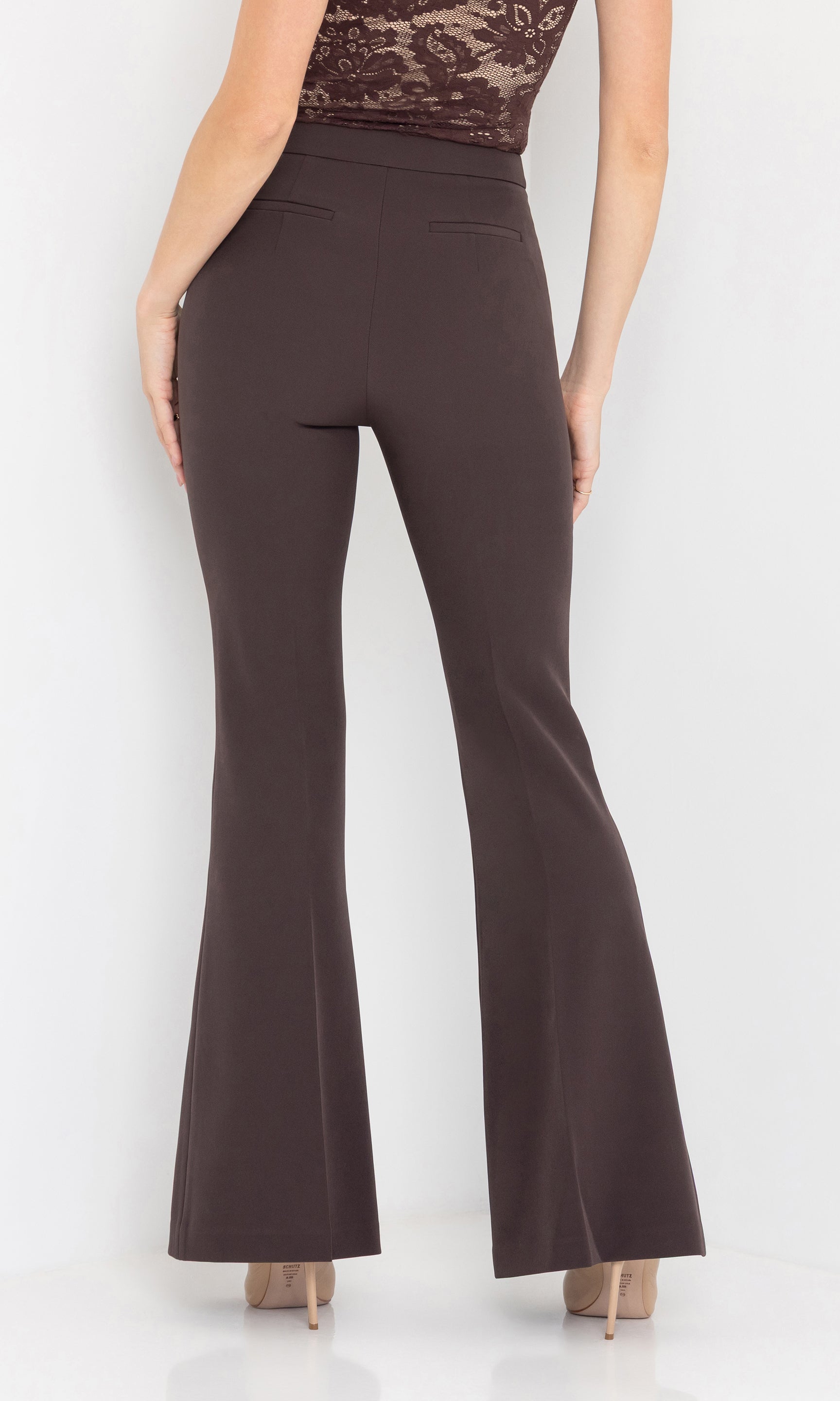 Three-quarter back view of the wesley crepe pants emphasizing the slim fit.