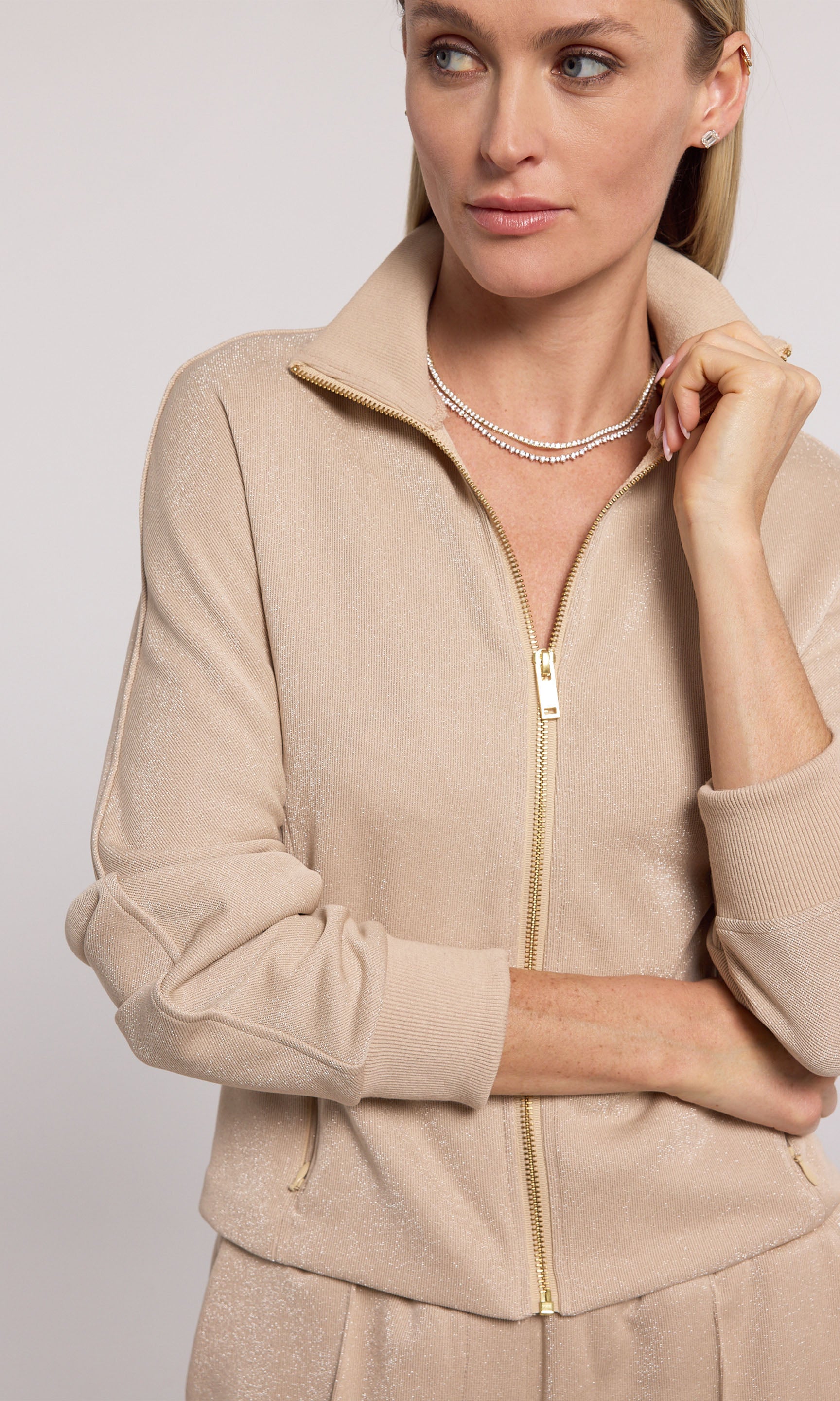 Truffle Ineza Shimmer Sweatshirt crafted from comfortable material, offering a stylish addition to any casual wardrobe.