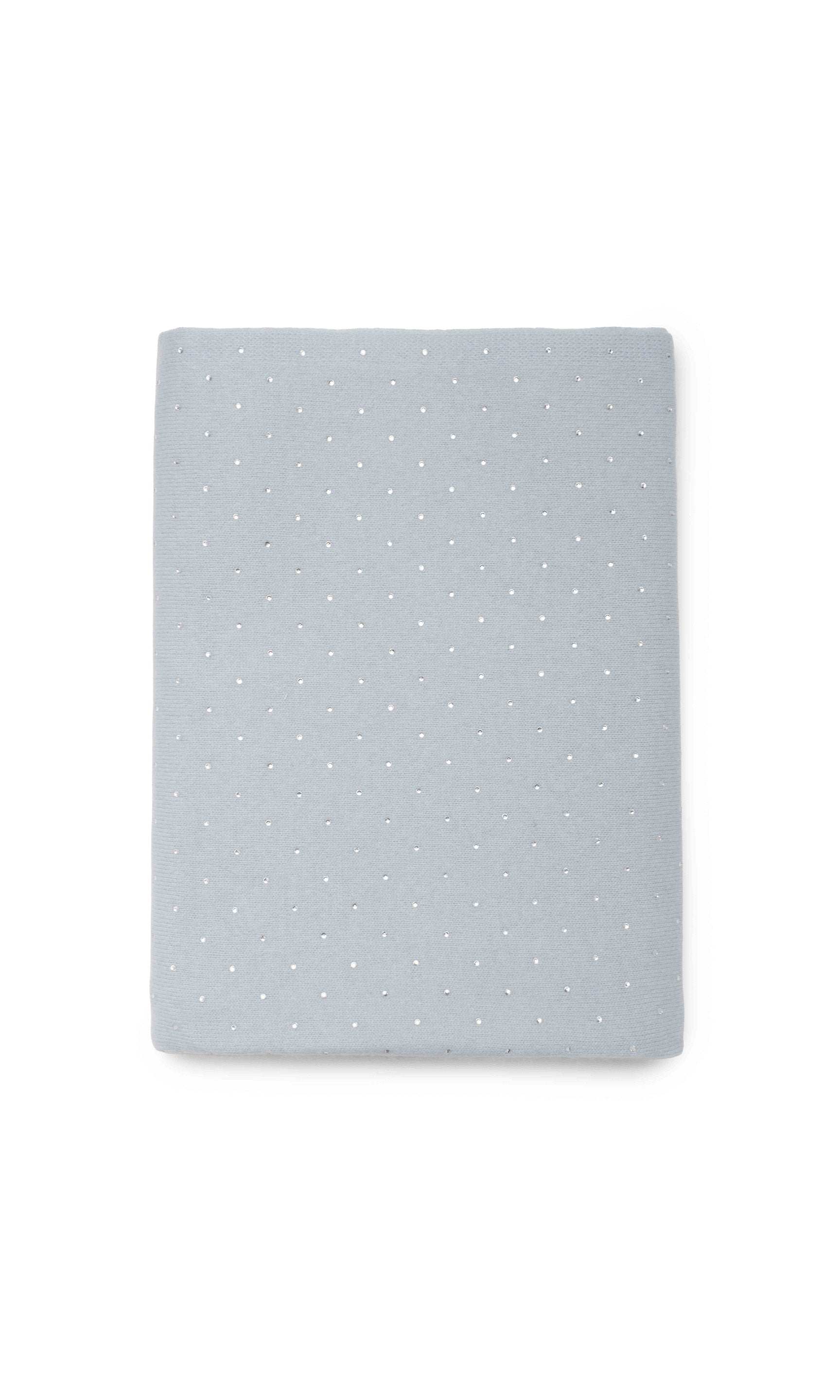 Light blue scarf with white polka dots on a white background