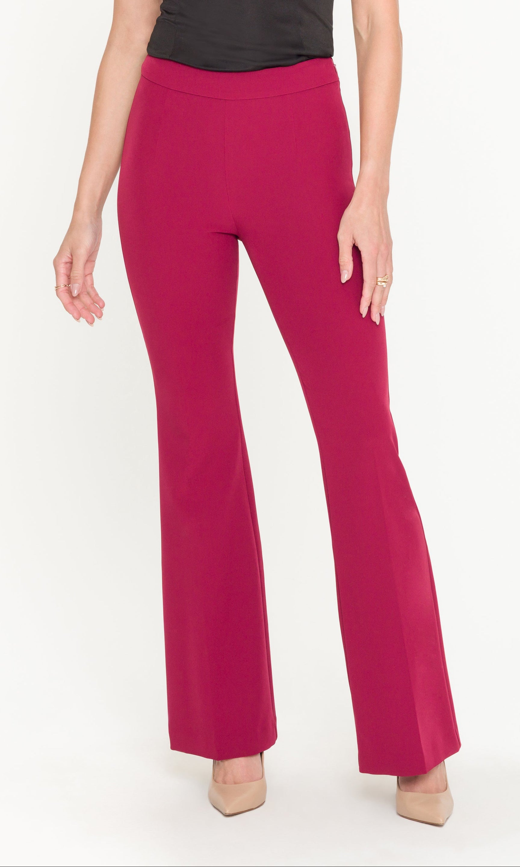 Crimson red pants worn by a person on a white background