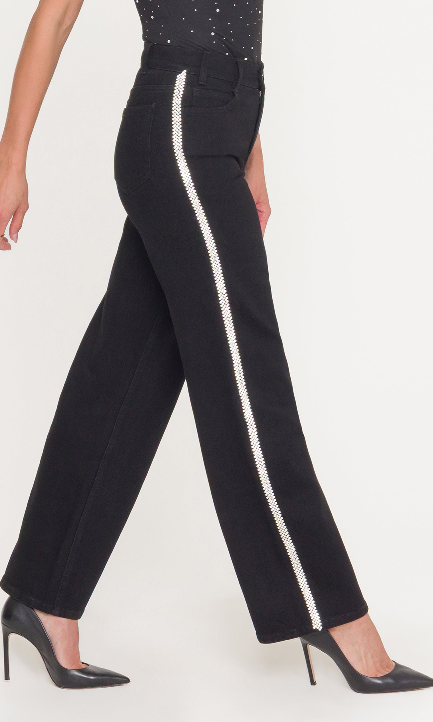 Side view of black pants with crystals down the leg on a white background