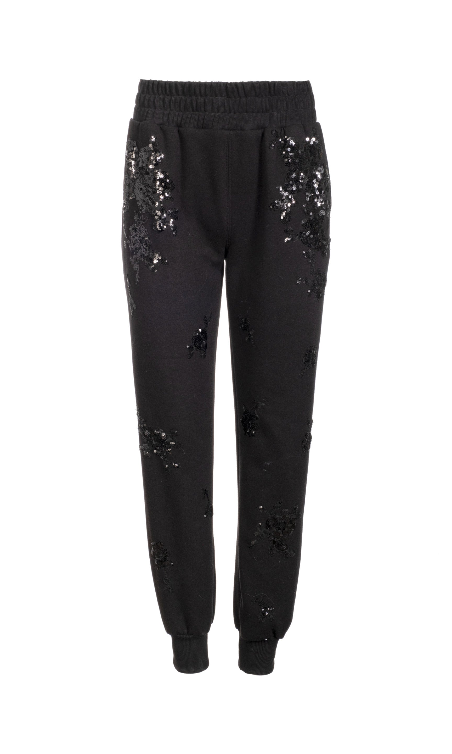 Black sequin jogger pants on a white background