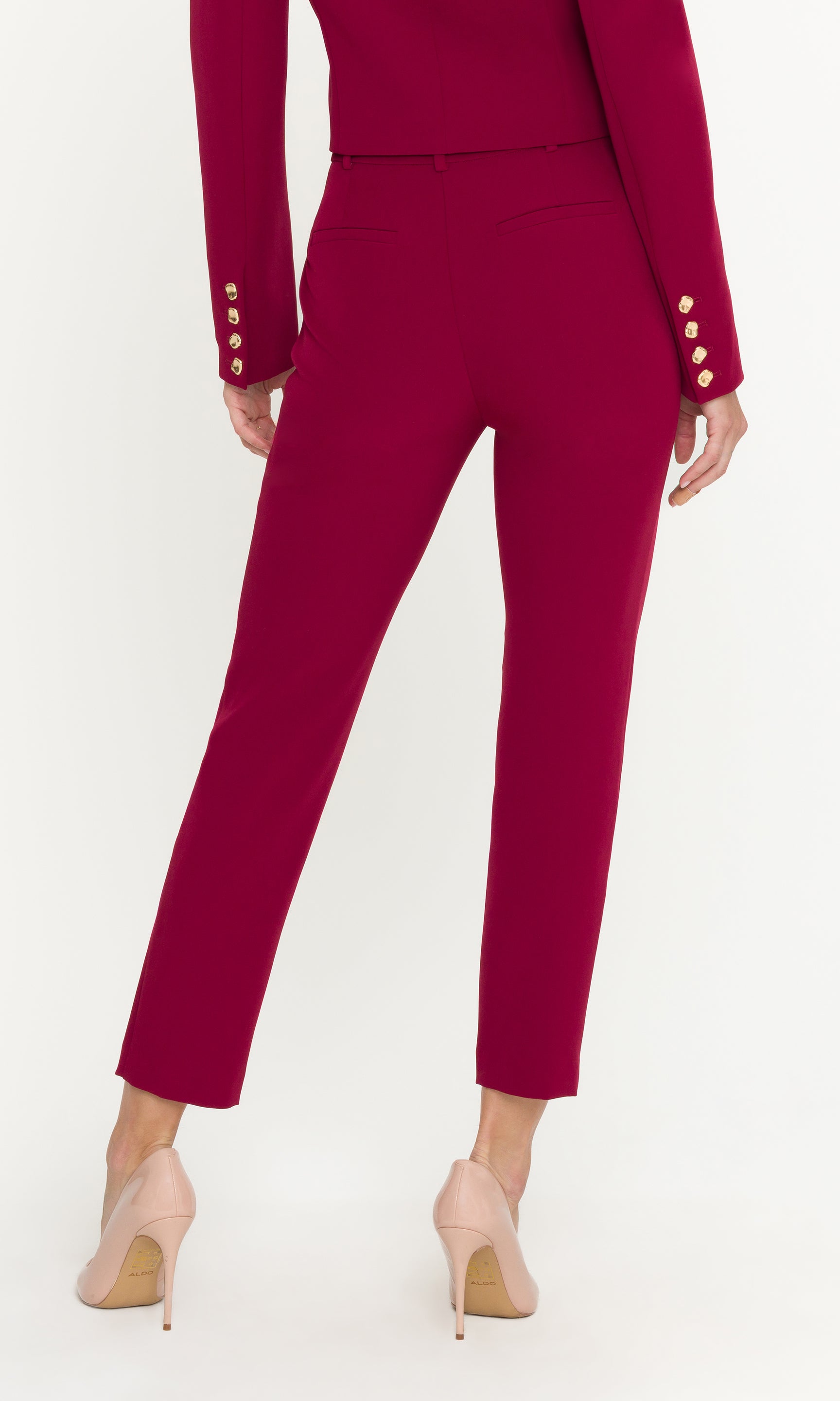 Red suit with gold buttons on a white background
