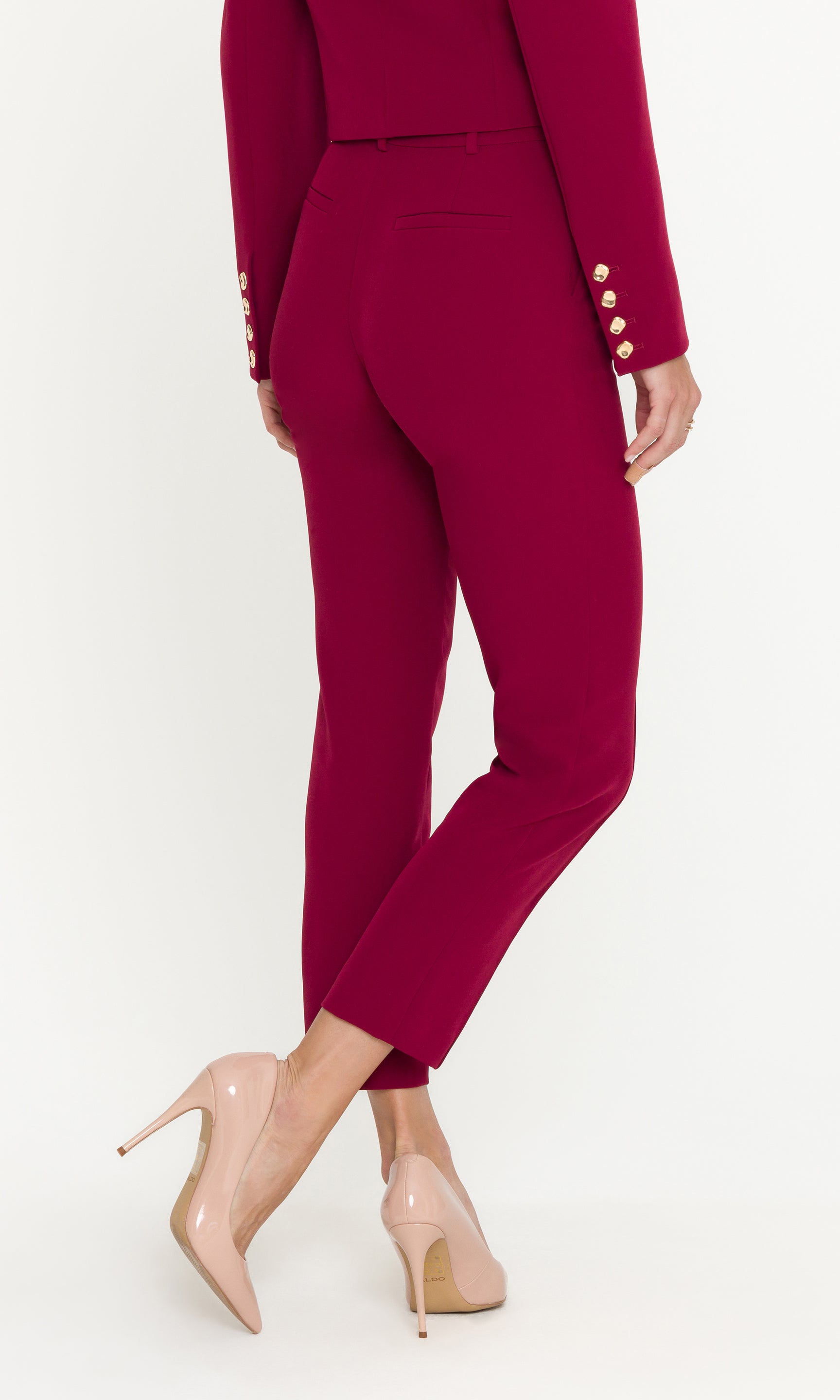 Red suit with high heels on a white background