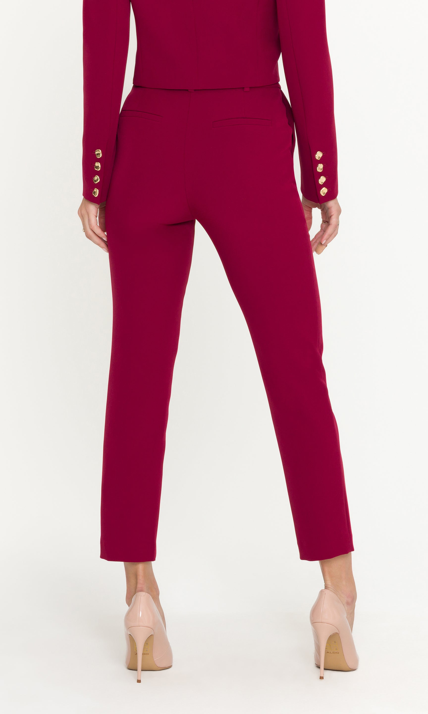 Red suit with gold buttons on a white background