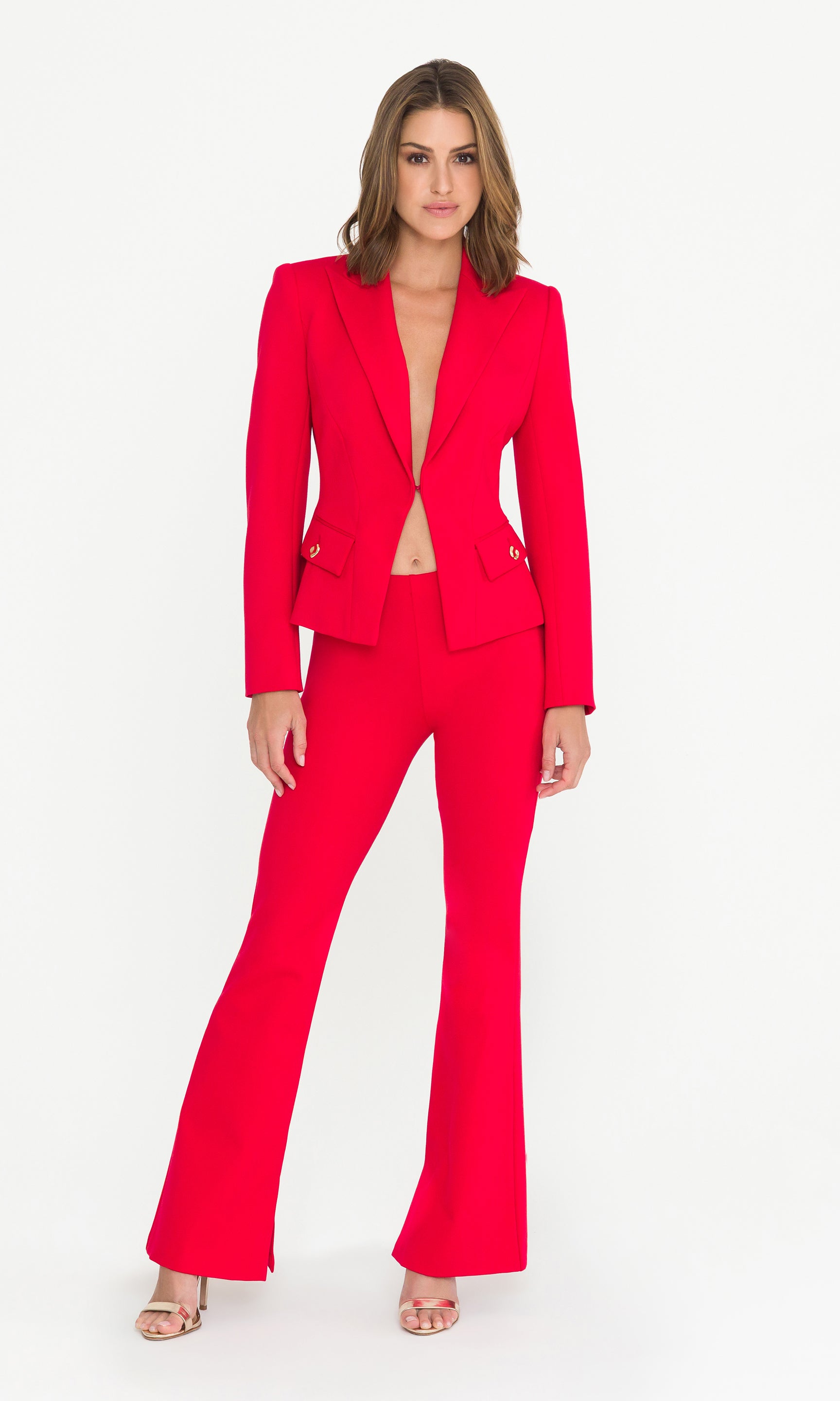 Woman wearing a red suit on a white background