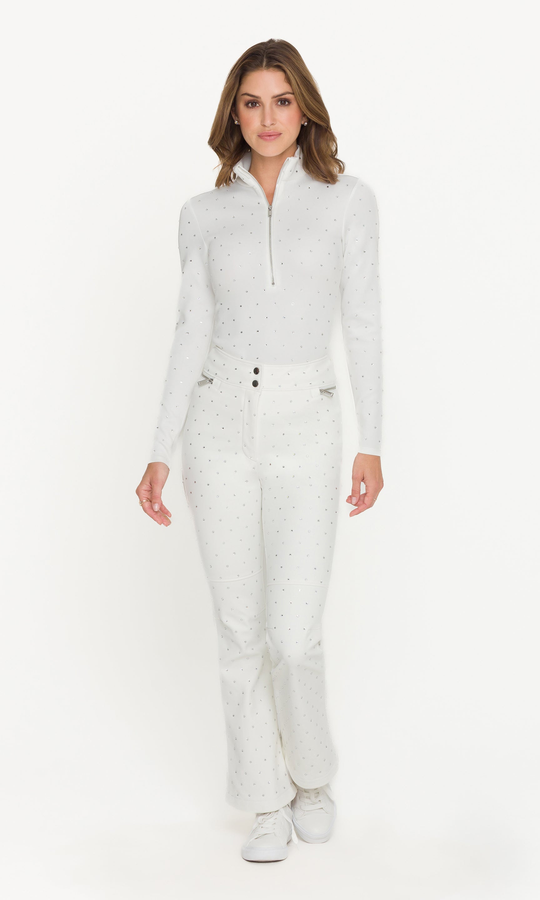 Woman wearing a white ski outfit on a white background