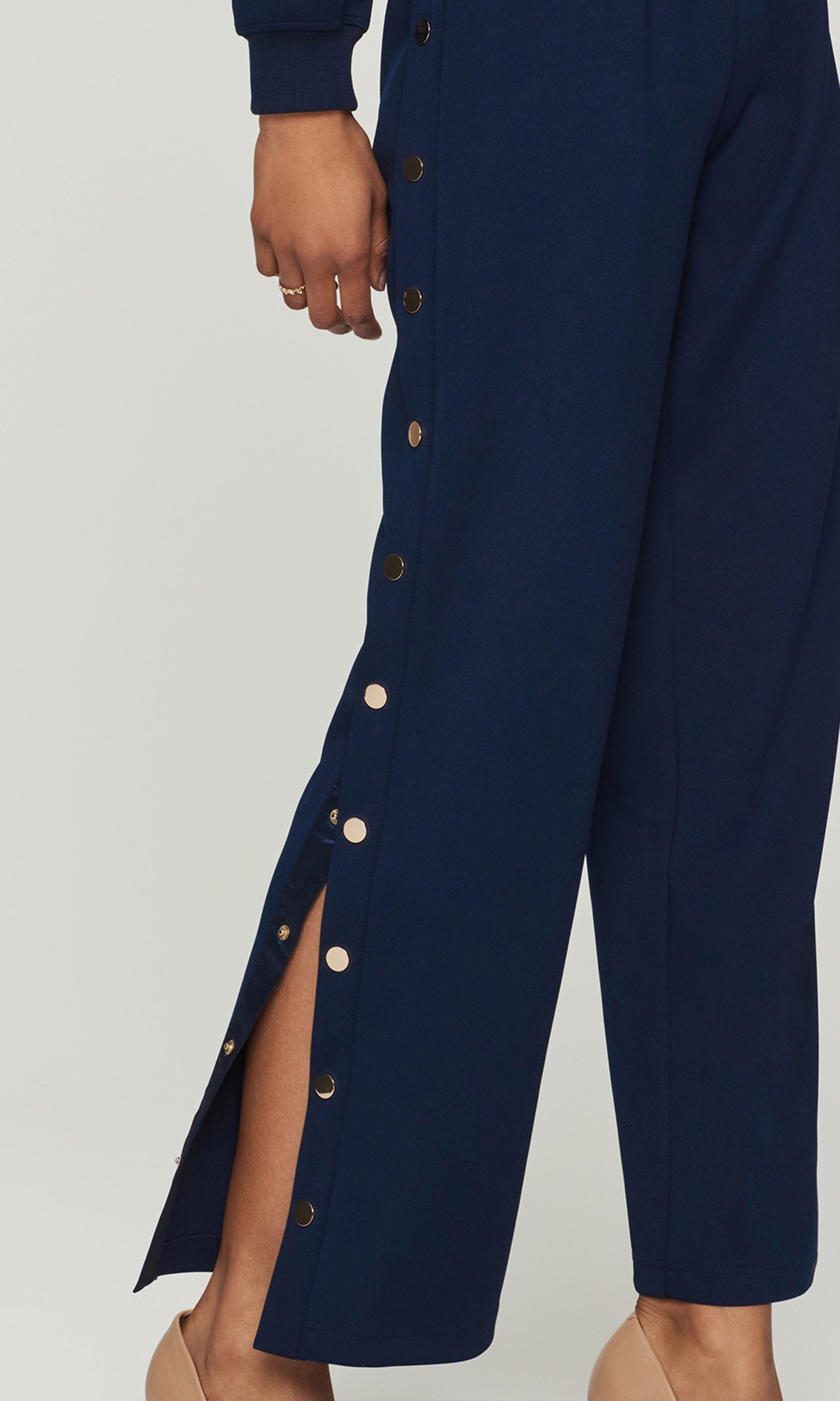 Close-up of Navy blue pants with snap-button details