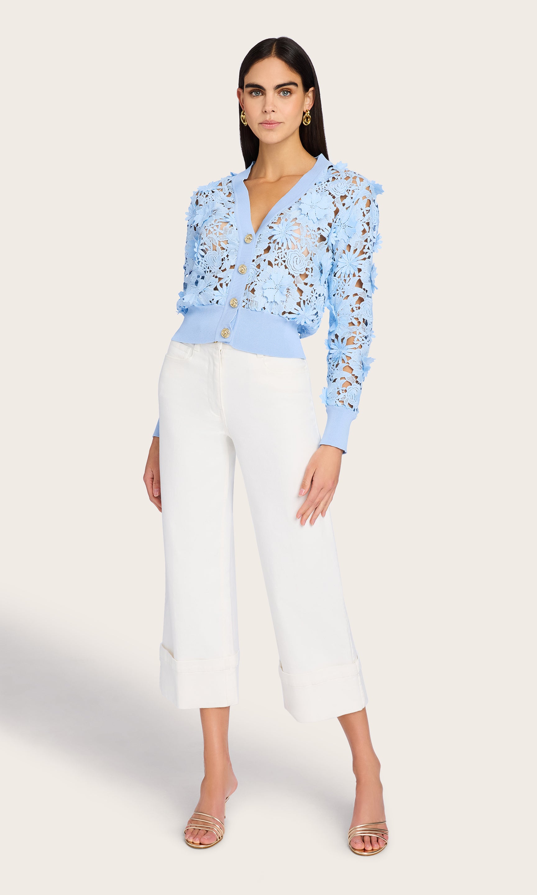 Full body view of the model wearing the Harlow Lace Cardigan, styled with high-waisted white pants for a fresh and polished look.