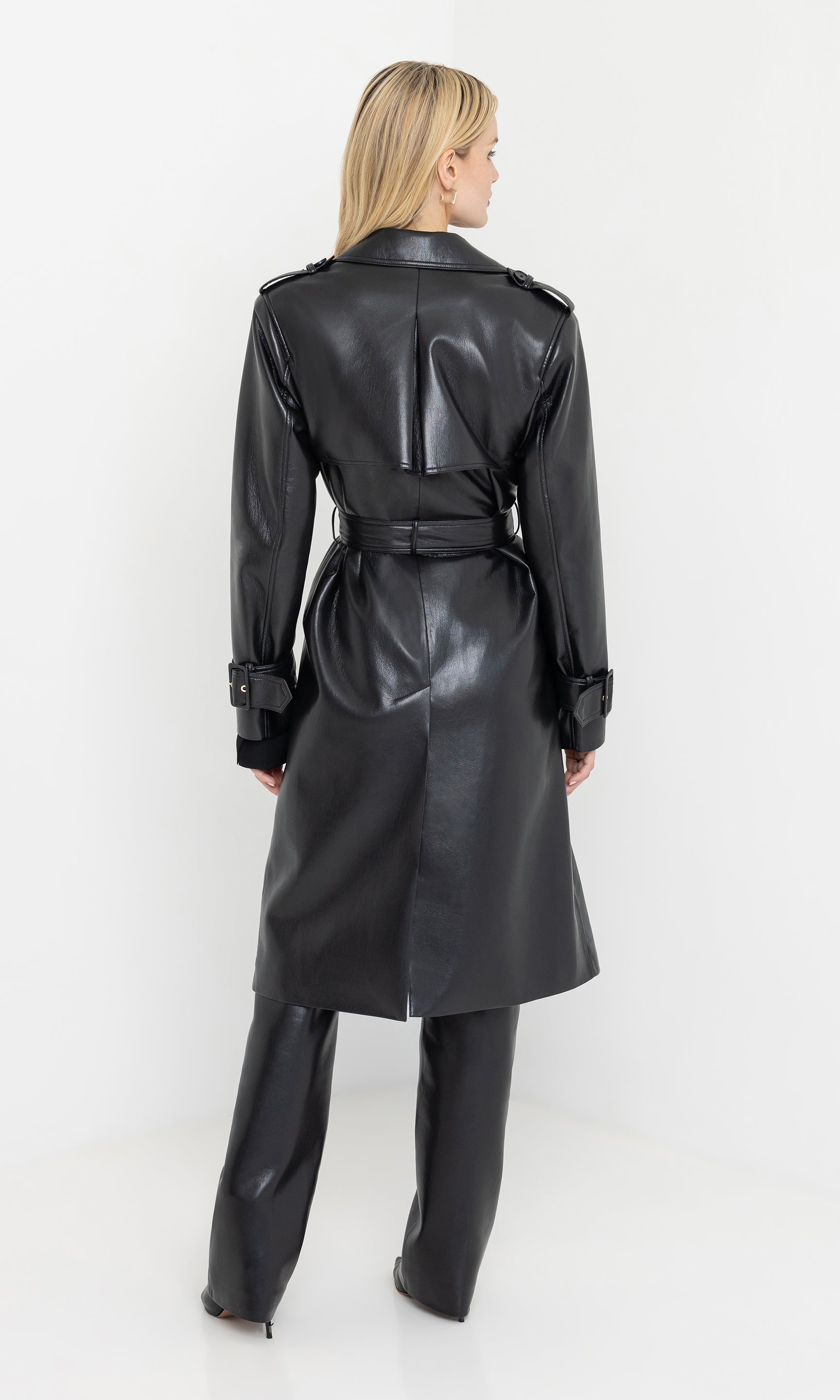 Back view of the hearst vegan leather trench coat showing the tailored fit.