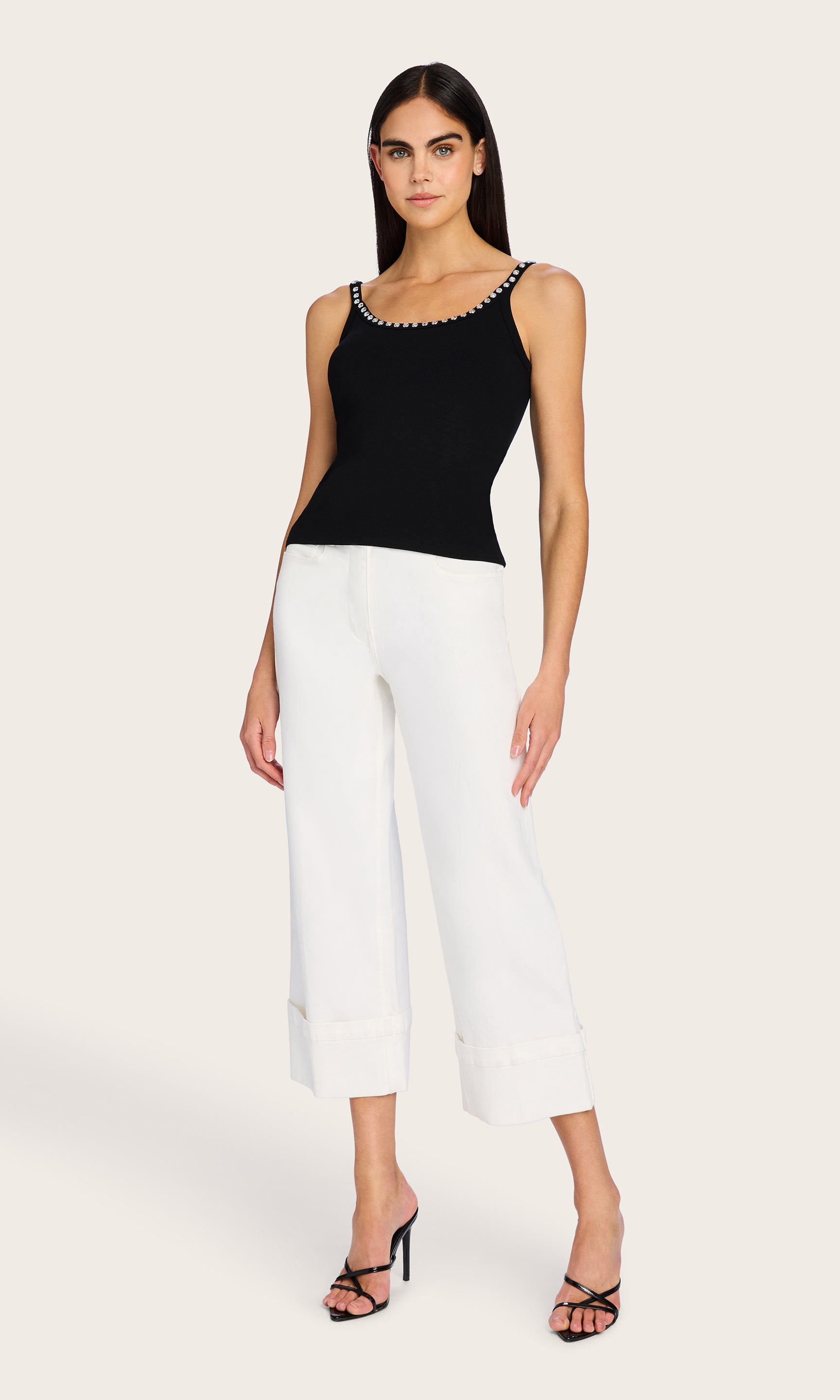 Full body shot of the model wearing the Iris Crystal Tank Top and wide-leg trousers, styled for a chic, warm-weather outfit.