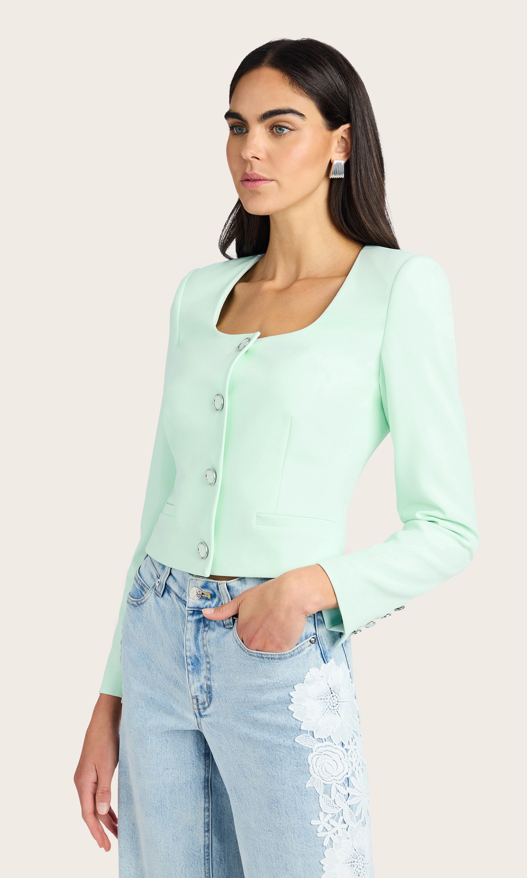 Side view of the Jina Crepe Blazer showing button detailing and seam structure.