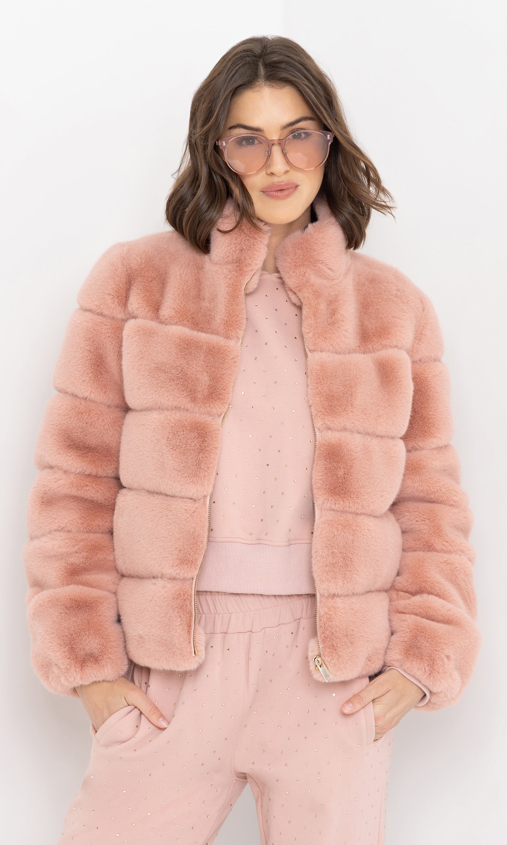 Front view of the brianna faux fur jacket with arms relaxed at sides.