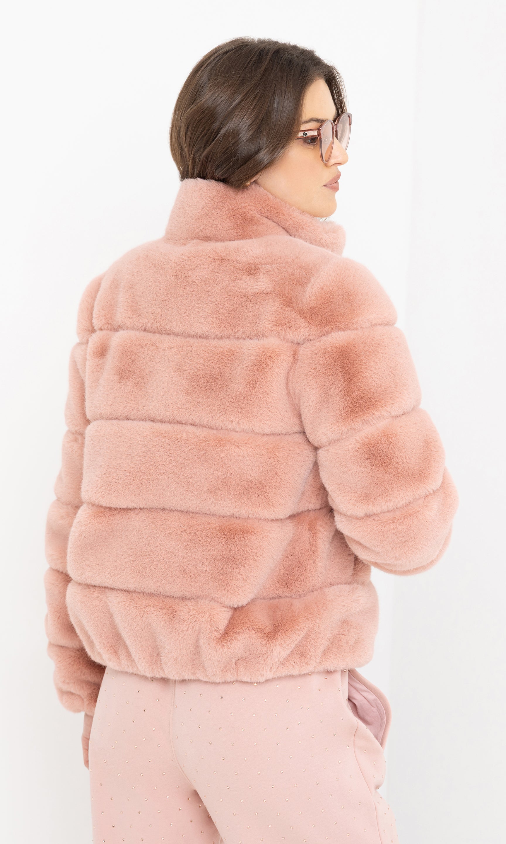 Rear view of the brianna faux fur jacket showing the cropped back.