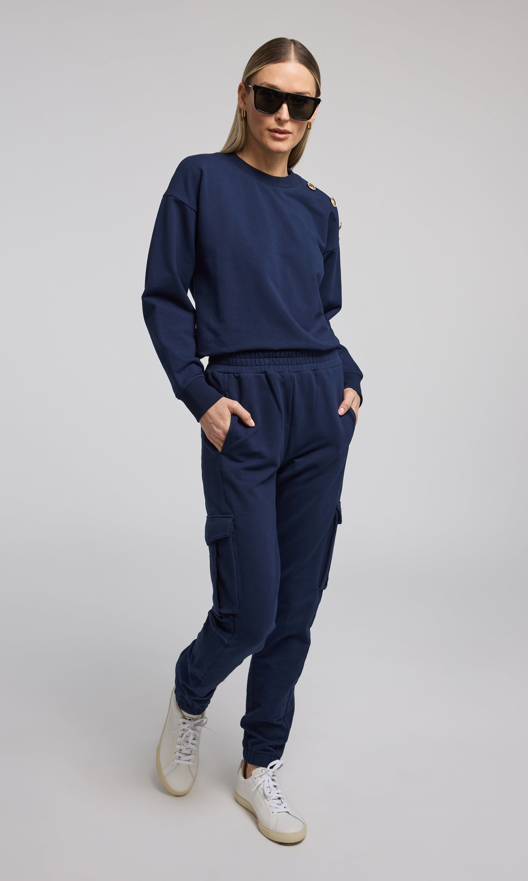 Navy sweatpants crafted from soft, stretchy material, offering comfort and flexibility for everyday wear.