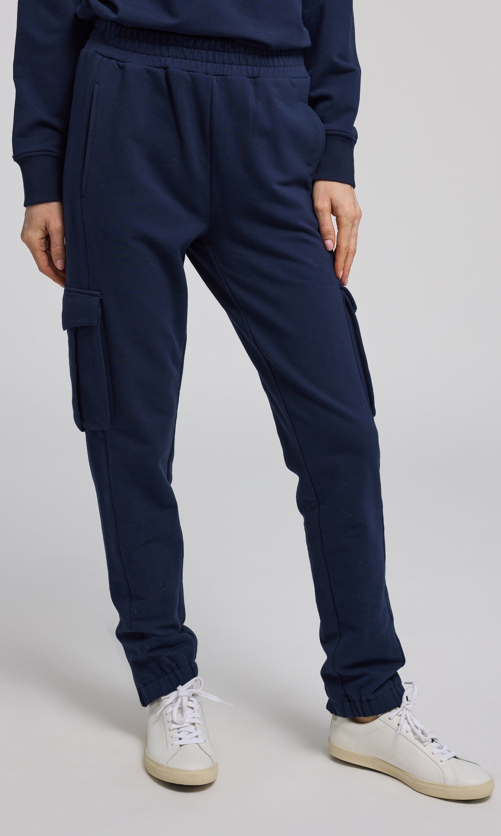 Navy sweatpants crafted from soft, stretchy material, offering comfort and flexibility for everyday wear.