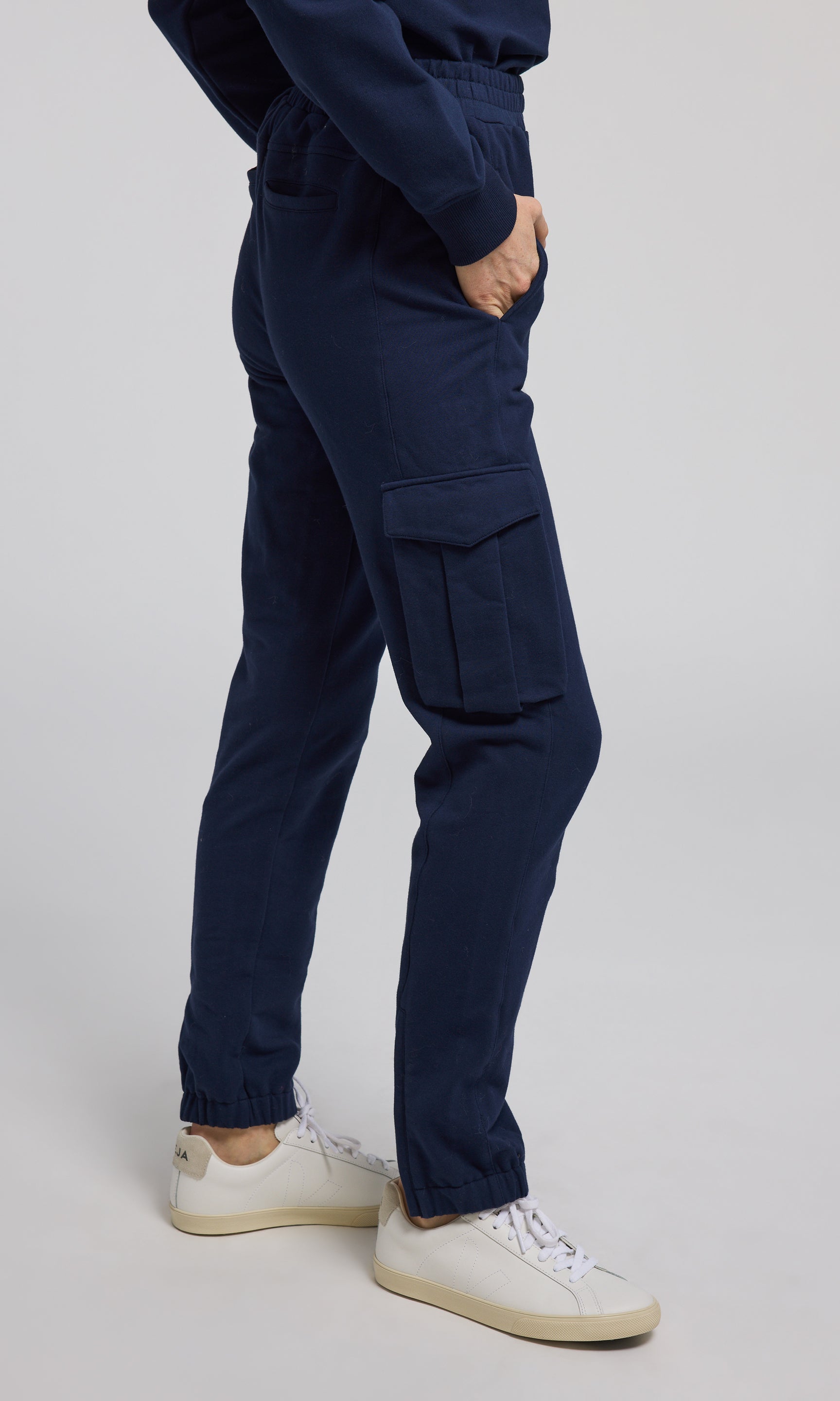 Navy sweatpants crafted from soft, stretchy material, offering comfort and flexibility for everyday wear.