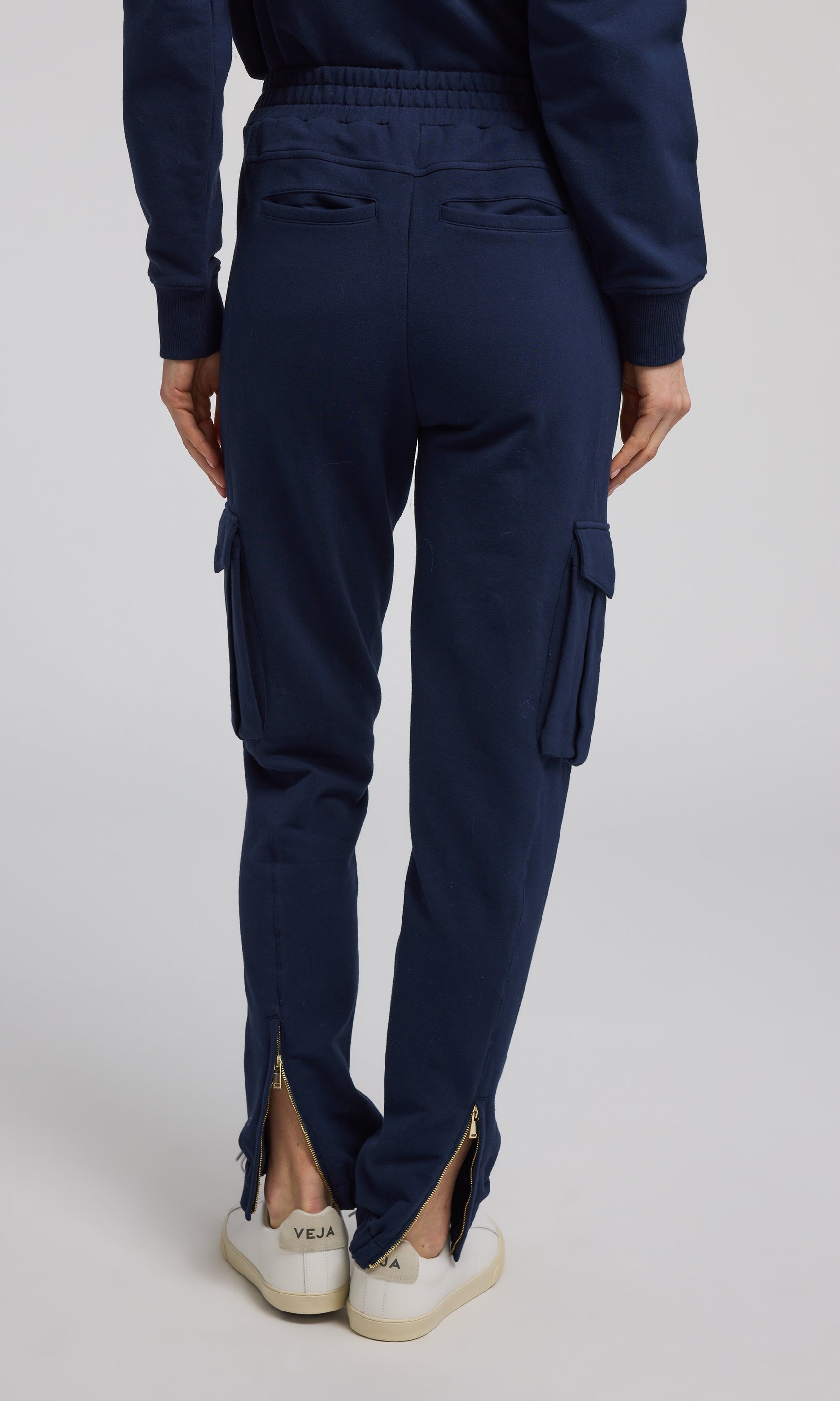 Navy sweatpants crafted from soft, stretchy material, offering comfort and flexibility for everyday wear.